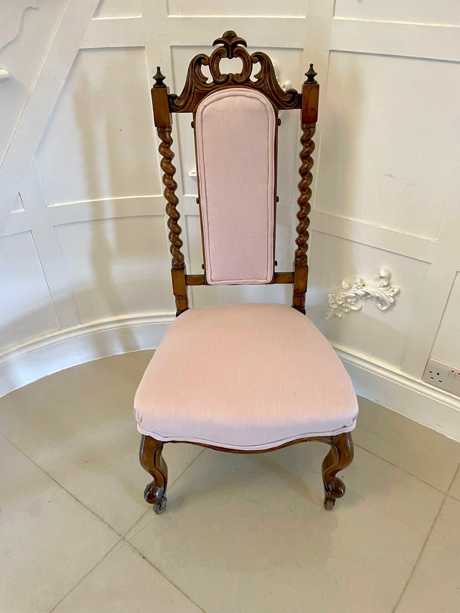 Antique Victorian carved walnut side chair having a pretty quality carved walnut top rail supported by solid walnut barley twist supports with original turned finials. It has a newly reupholstered back panel and seat in a quality pale pink fabric,