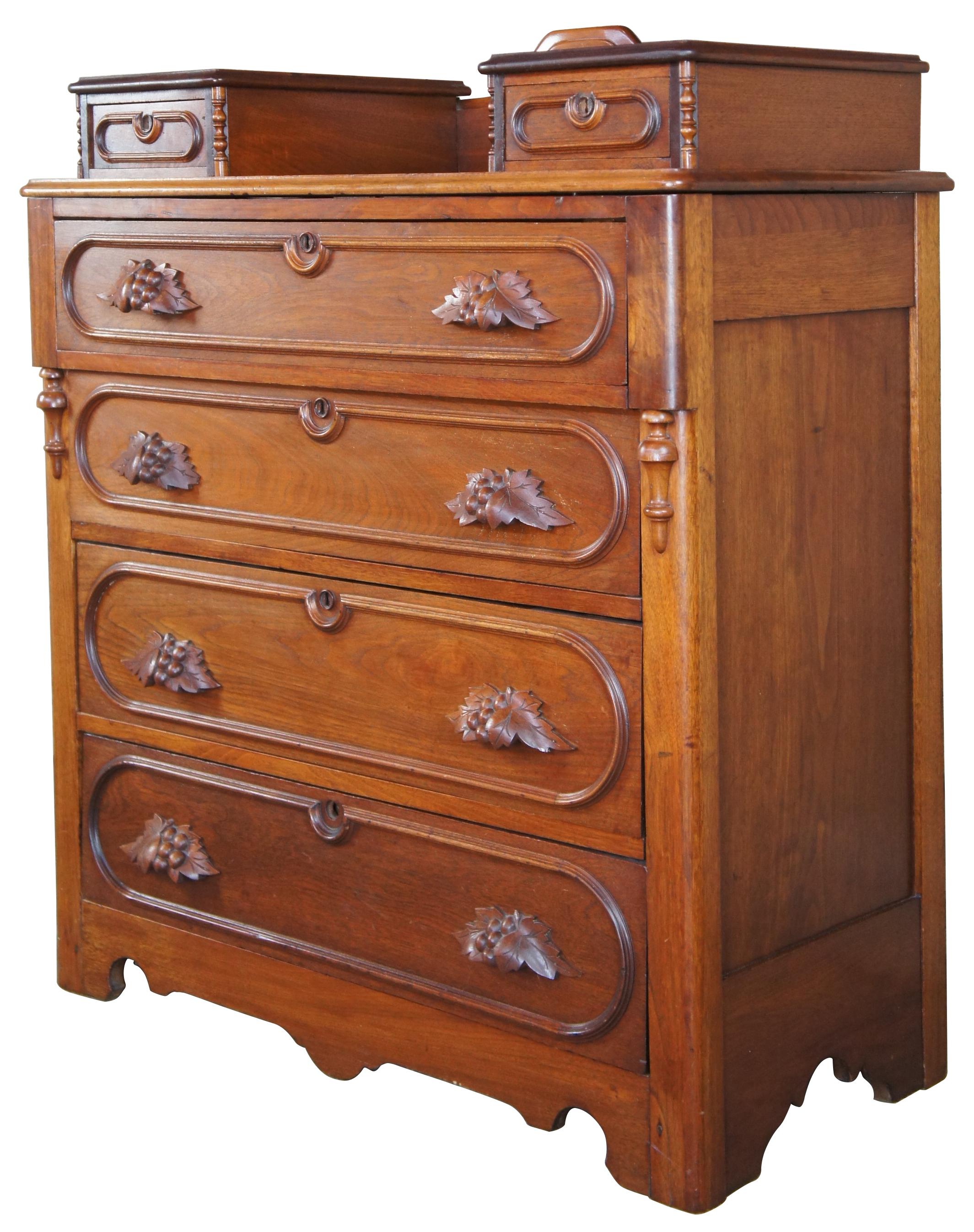Circa 1880s Victorian dresser. Made from walnut with two glovebox drawers over four larger lower drawers. Features ovular shaped drawer trim, fruit and nut carved pulls, downward turned finials and serpentine cut lower apron. The drawers are