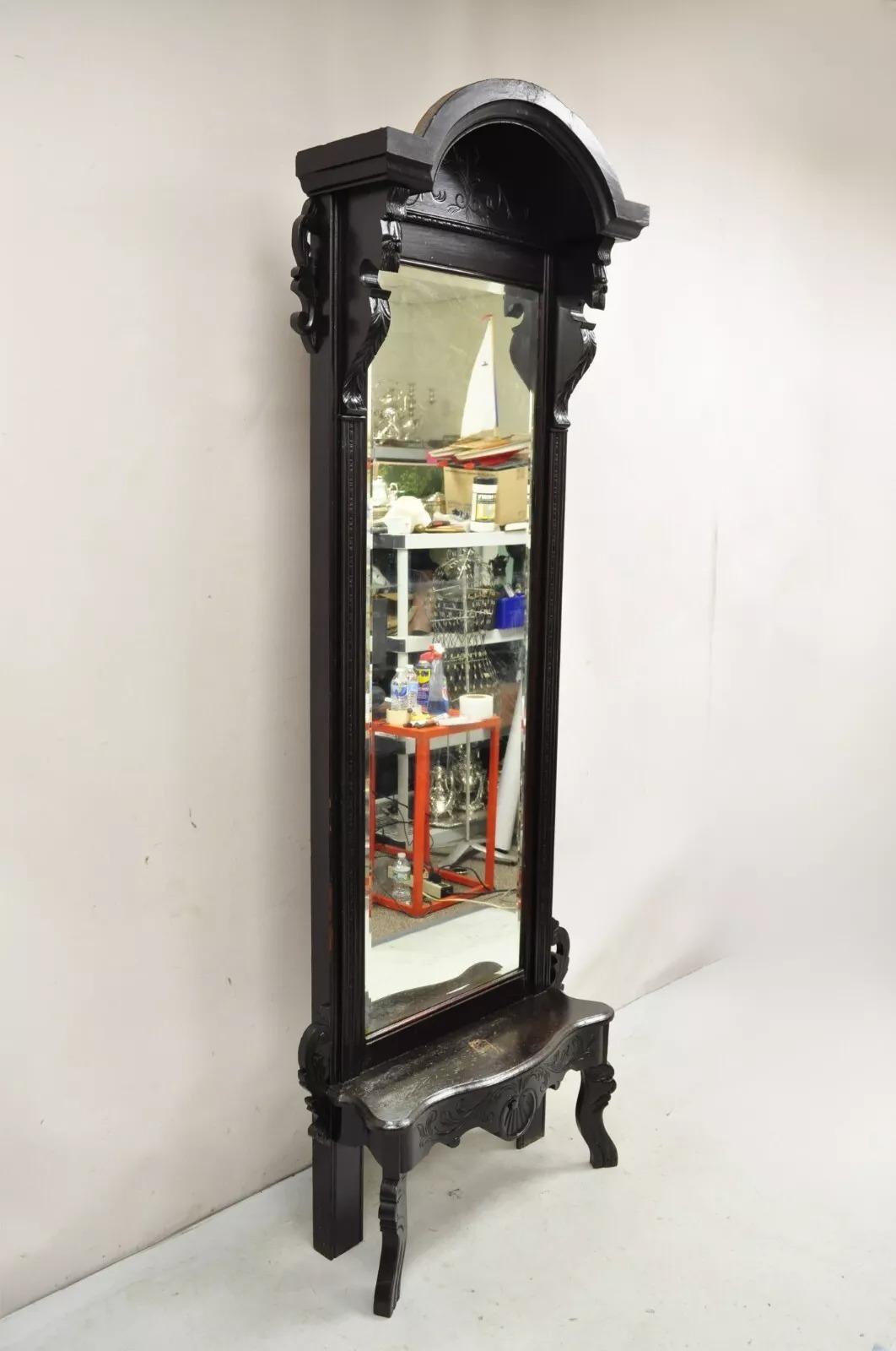 Antique Victorian Carved Walnut Tall Hall Entryway Pier Mirror with Carved Figures. Circa Late 19th Century. Measurements: 91