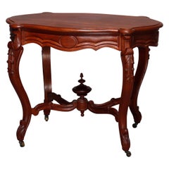 Antique Victorian Carved Walnut Turtle Top Parlor Table, circa 1890