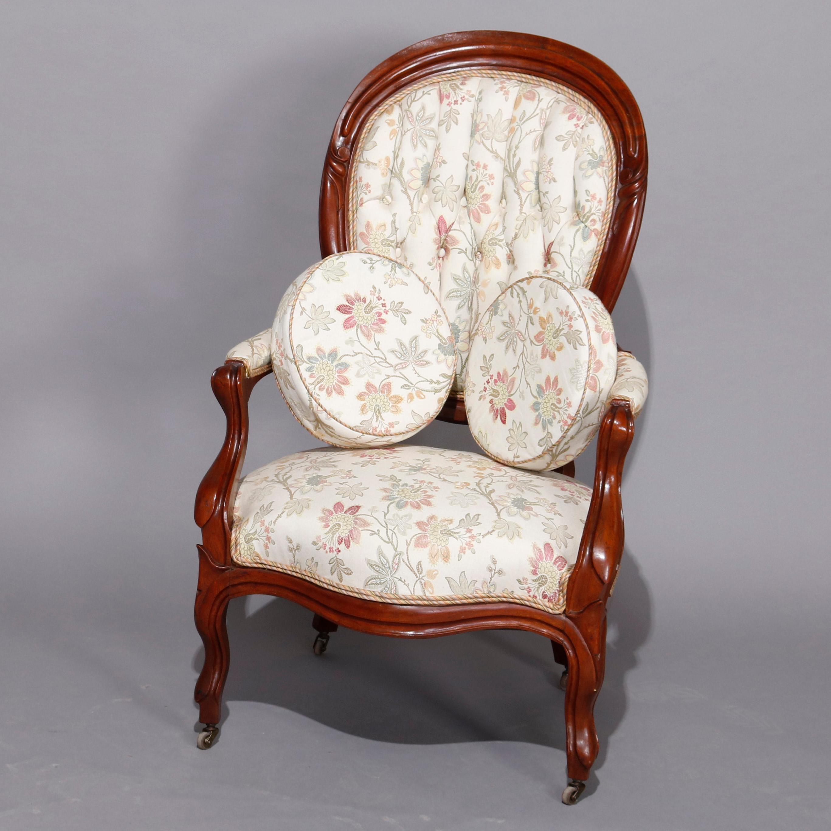 An antique Victorian parlor set offers carved walnut frames with upholstered seats and tufted backs, raised on cabriole legs, and includes gentleman's armchair and ladies side chair with skirt rail, circa 1890.

Measures: 36.25