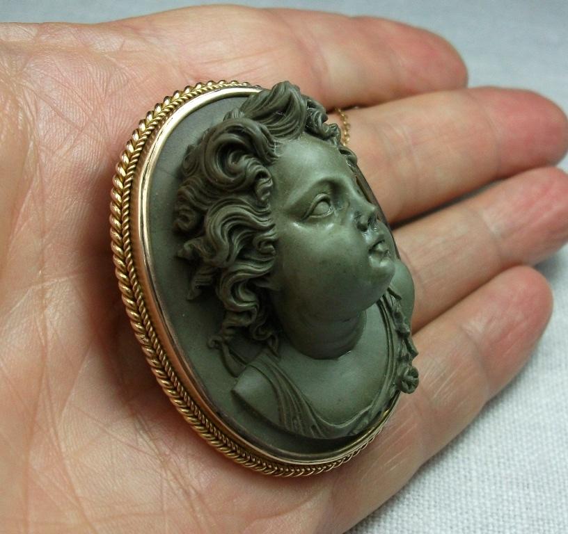 Women's or Men's Antique Victorian Cased Lava Stone Front Face Cupid Cameo Brooch For Sale