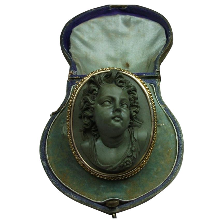Antique Victorian Cased Lava Stone Front Face Cupid Cameo Brooch For Sale