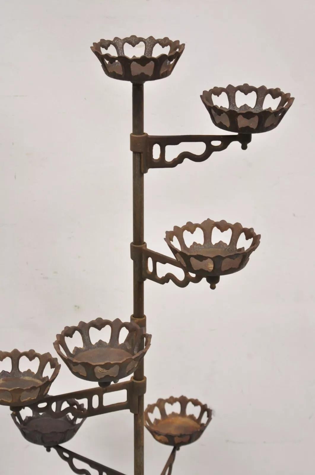 Antique Victorian Cast Iron 9 Tier 8 Arm Swing Pedestal Plant Stand. Circa Late 19th Century. Measurements: 53