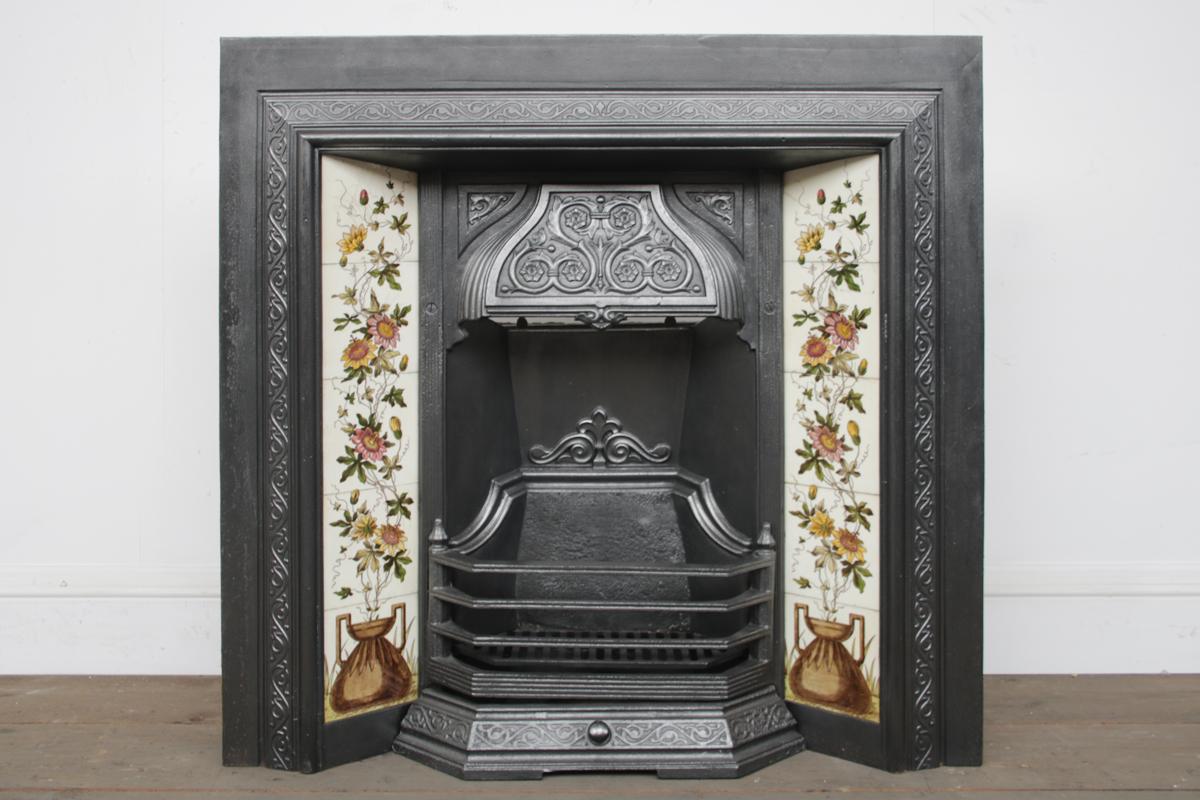 Antique reclaimed late Victorian cast iron and tiled fireplace grate produced by the Falkirk foundry. Circa 1885.

Completed with a set of original fireplace tiles, priced separately.

For detailed sizes please see the size diagram in the image