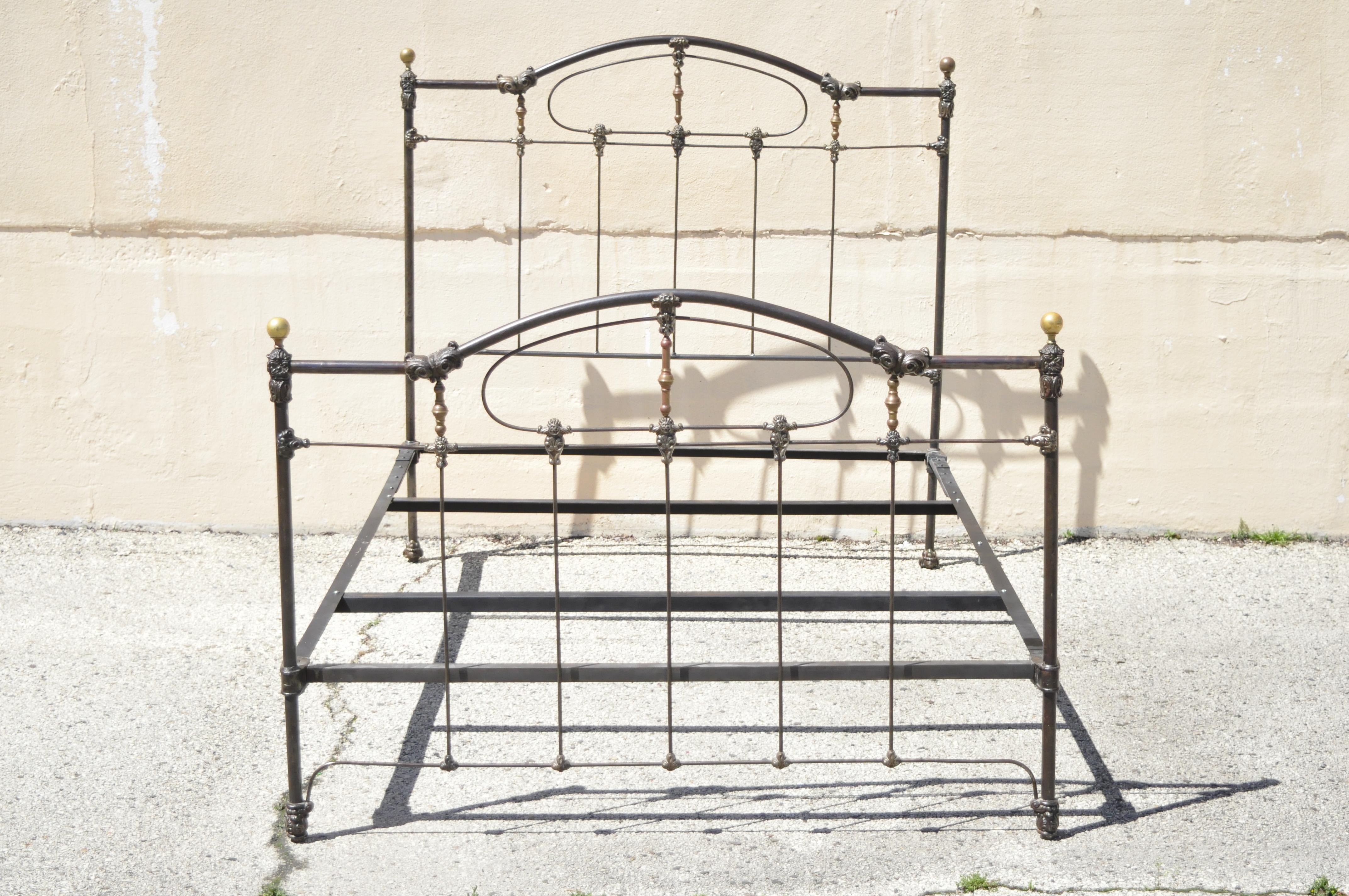 Antique Victorian cast iron brass and steel queen size bed frame with brass finials. Item features queen size frame, brass ball finials, steel iron frame, very nice antique item, great style and form. Believed to be Late 19th Century. Measurements: