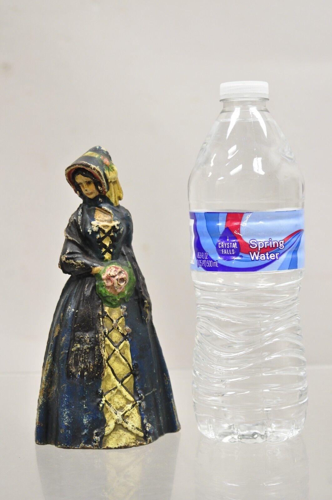 Antique Victorian Cast Iron Figural Colonial Woman Painted Door Stop. Circa Early 1900s. Measurements: 7