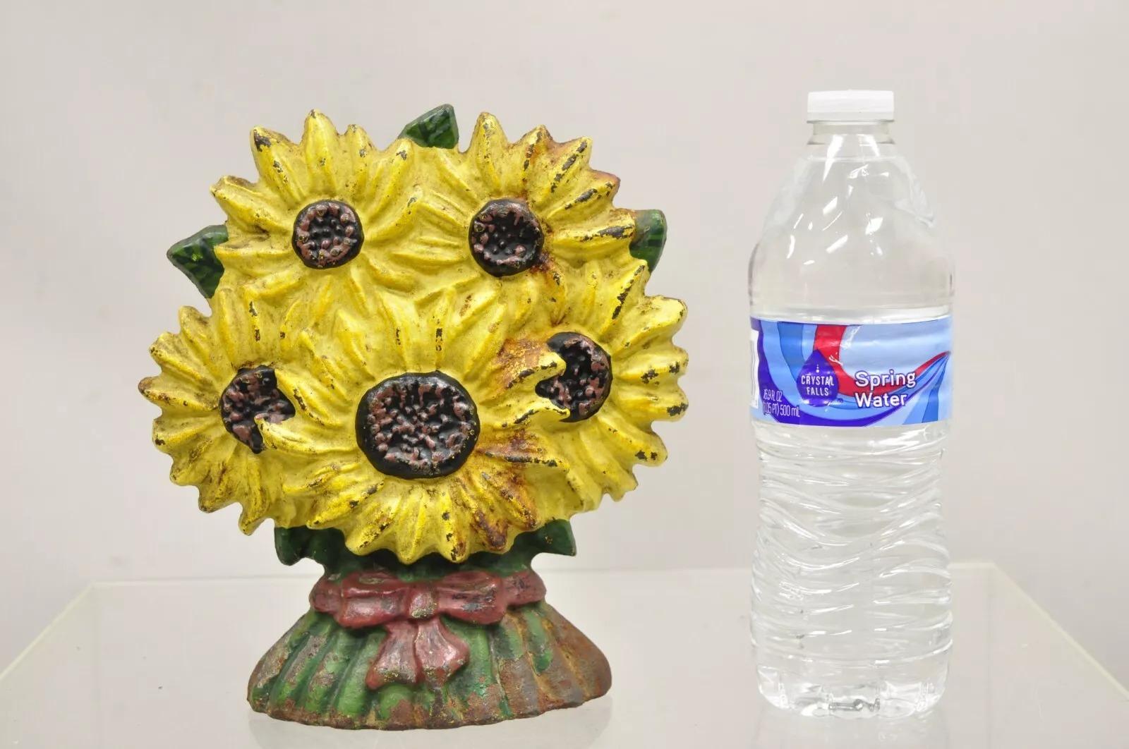 Antique Victorian Cast Iron Figural Yellow Sunflower Bouquet Painted Door Stop. Circa  Early 1900s. Measurements: 7.5