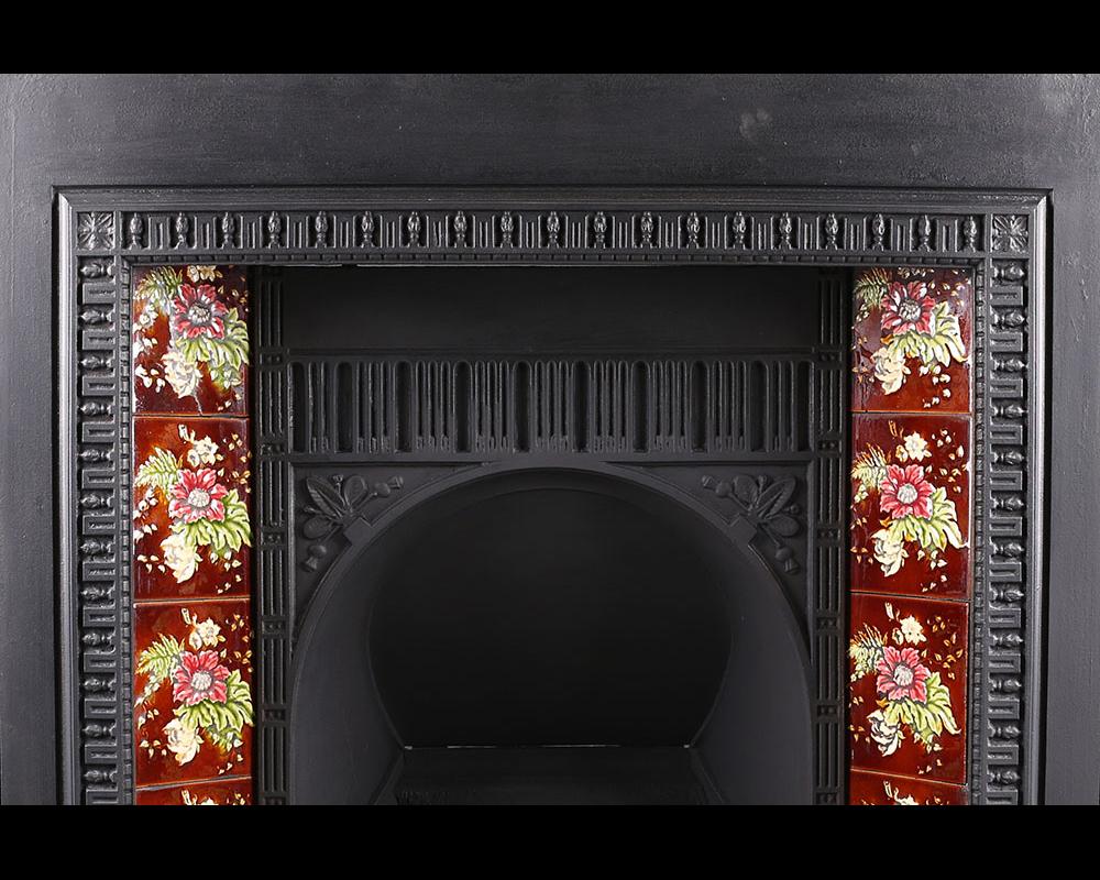 Antique Victorian cast iron fireplace insert, late 19th century.
Antique Victorian cast iron fireplace insert set with colourful floral tiles and with a flat arched canopy, English, late 19th century.

Stock no: RG1927.
 