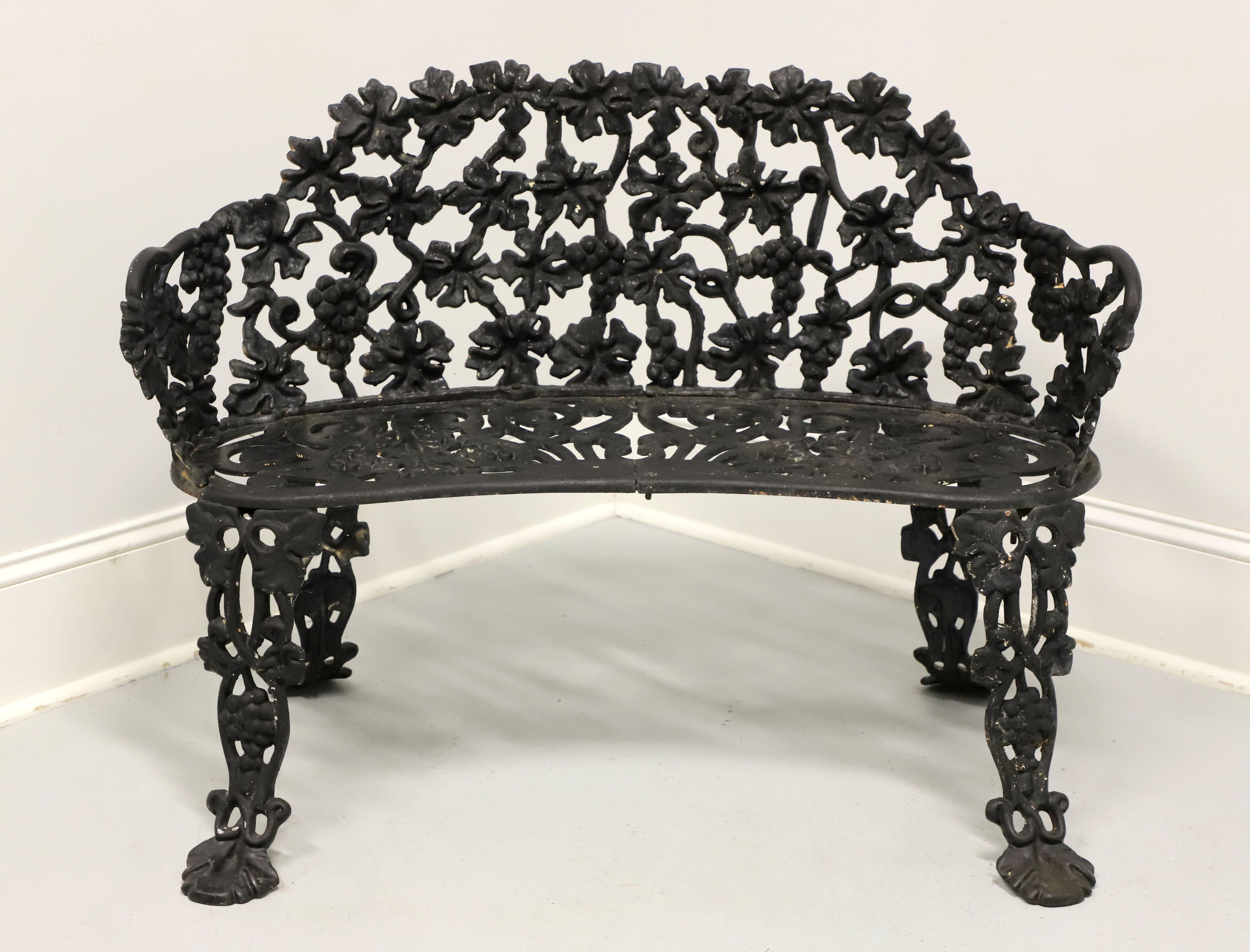 An antique Victorian style grape leaf motif garden four piece patio set, unbranded. Cast iron construction in a pierced Rococo design of grape leaves. Very well made and heavy. Set is ready for use as is or apply a fresh coat of paint. A smaller in