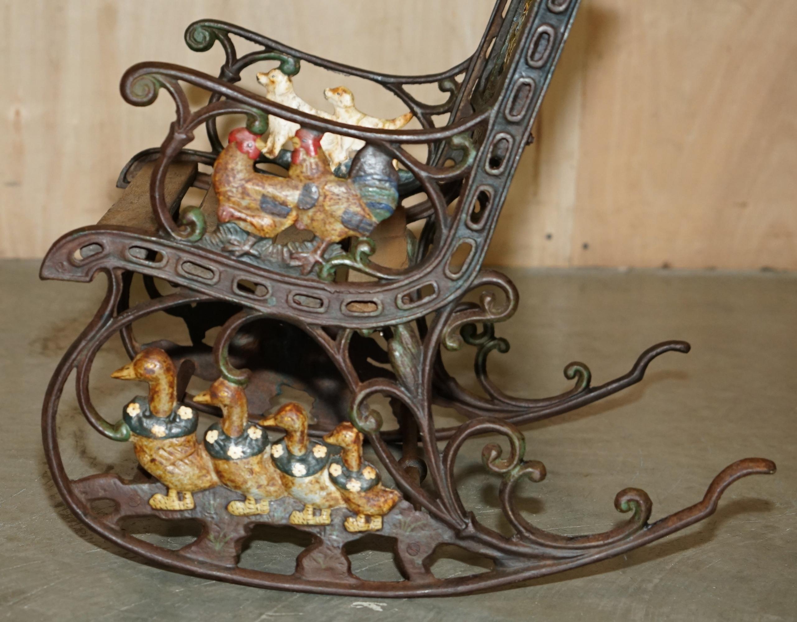 ANTiQUE VICTORIAN CAST IRON HAND PAINTED SMALL CHILDRENS GARDEN ROCKING ARMCHAIR For Sale 1