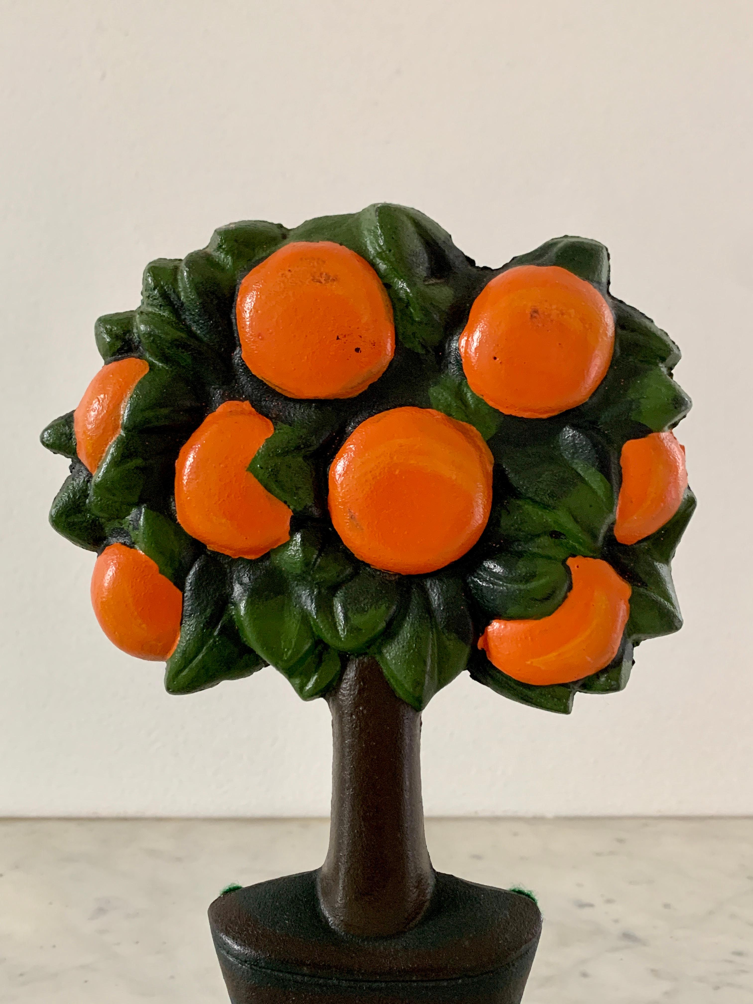 A beautiful antique Victorian cast iron orange tree topiary door stop 

USA, Late 19th Century

Measuers: 5.63
