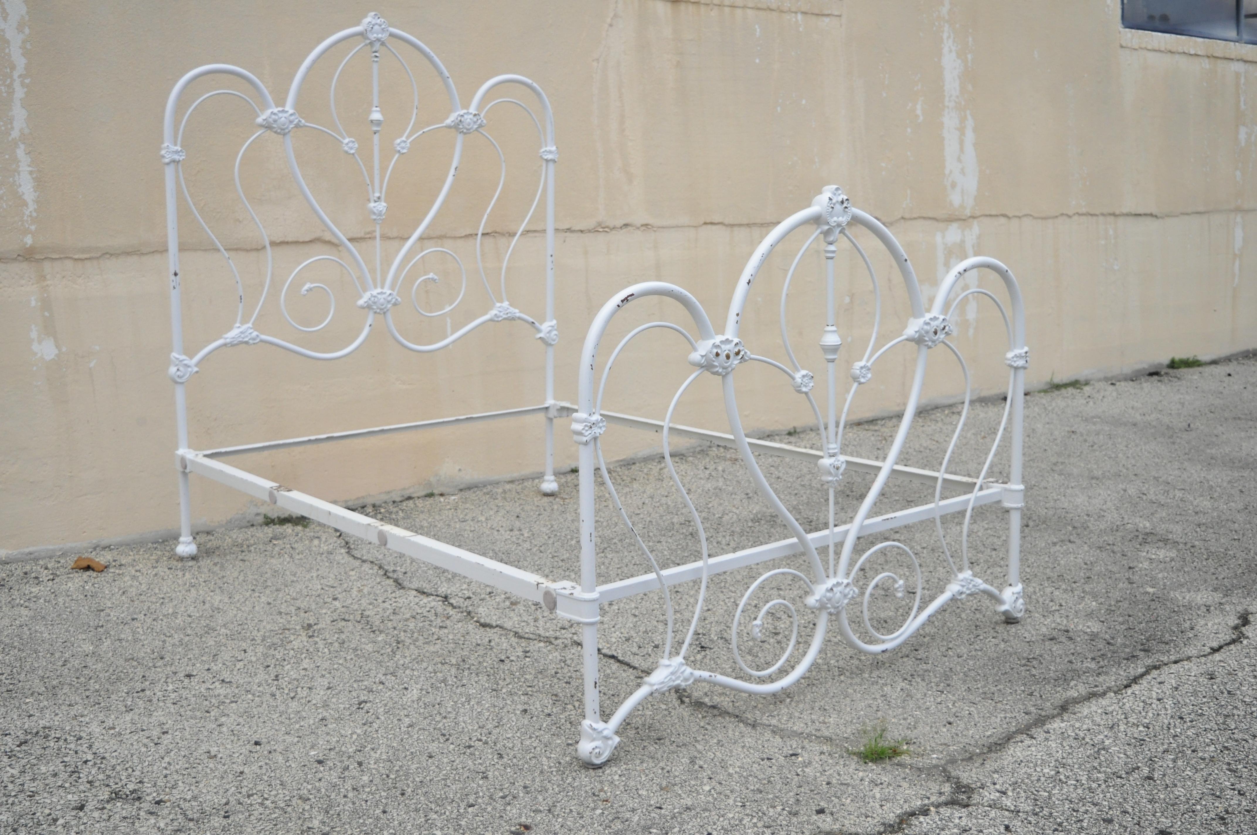 Antique Victorian cast iron ornate white scrollwork full size metal bed frame. Item features heavy cast iron frame, white lacquered finish, ornate scrollwork, full size frame, quality American craftsmanship, great style and form, mid-20th century.