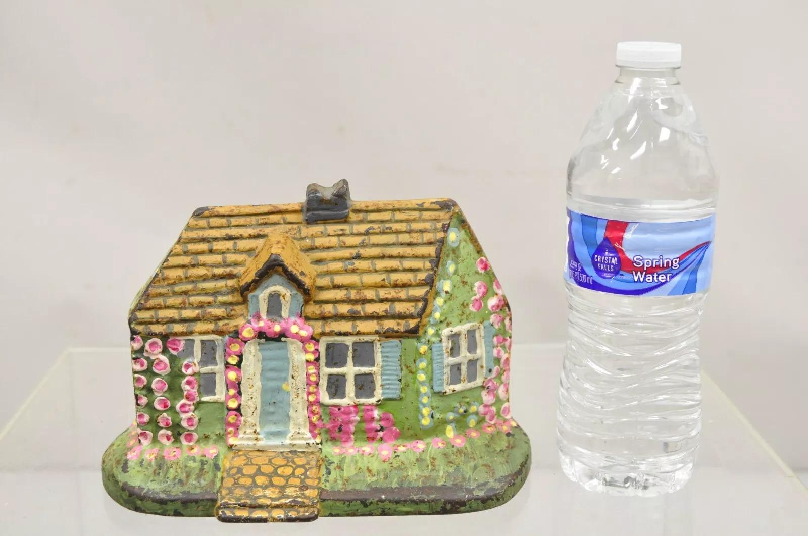 Antique Victorian Cast Iron Painted Green and Pink Cottage House Door Stop. Circa Early 1900s. Measurements: 5.5