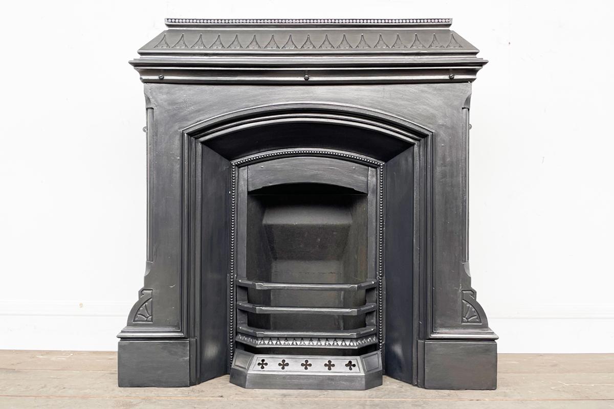 Antique Victorian cast iron school fireplace. Circa 1870. Removed from an Albert Schools, Marple.

Finished with traditional black grate polish and supplied with a new clay fireback and cast iron bottom grate (not pictured) ready for a solid fuel