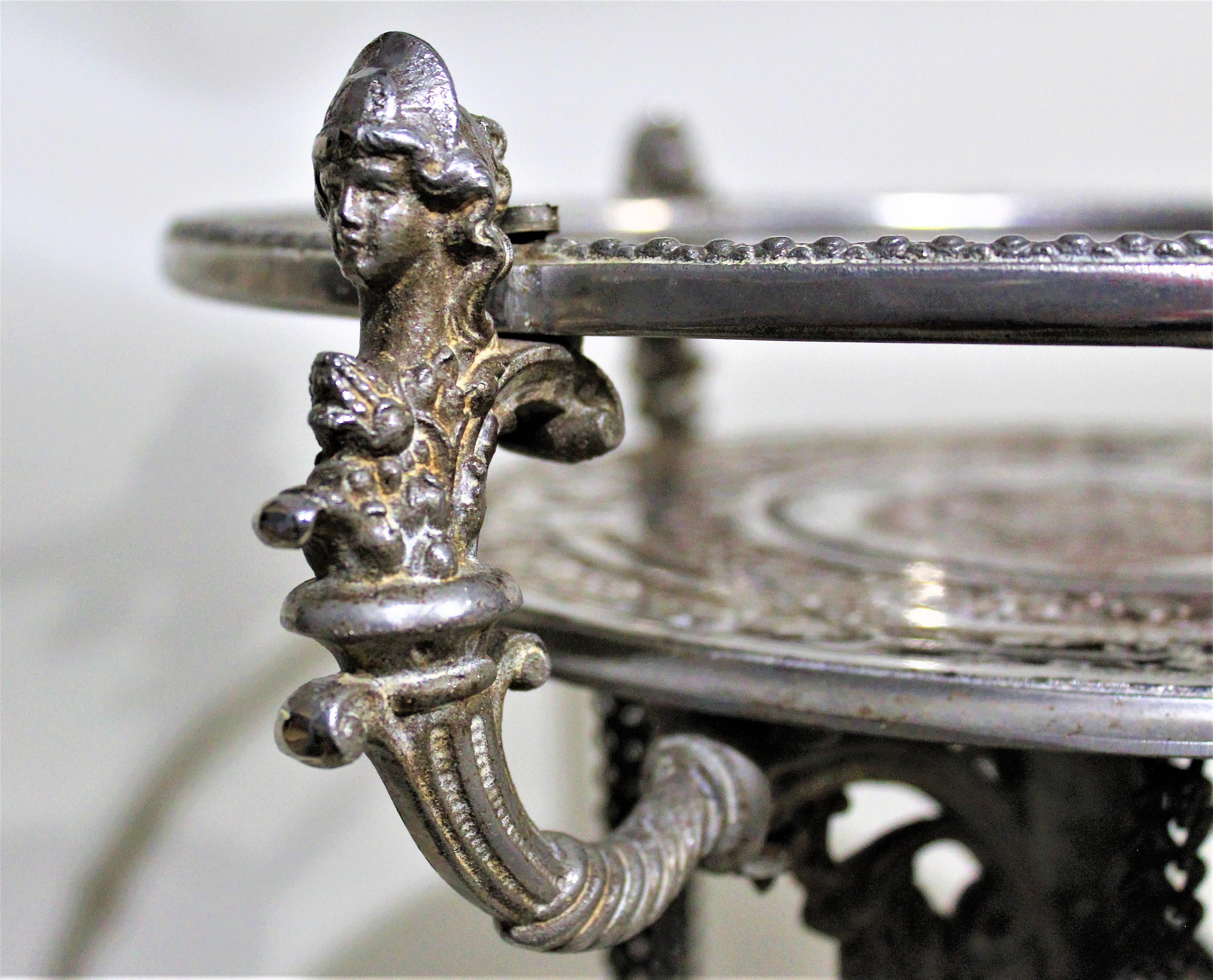 Antique Victorian Cast Metal Plated Pedestal Table Figural Accents Engraved Top In Fair Condition In Hamilton, Ontario