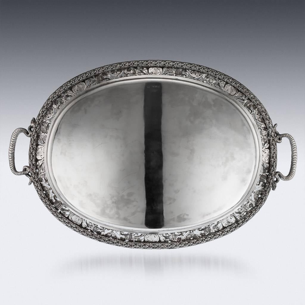 Antique late 19th century Victorian Cellini pattern solid silver large serving tray, of oval form the pierced border, featuring a frieze of masks, lions, cornucopia and fruiting vines in the classical Cellini revival taste, within a laurel rim and