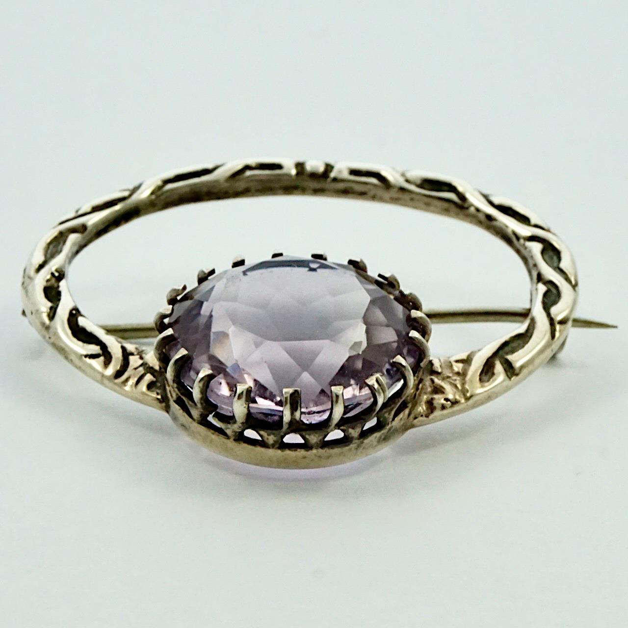 Wonderful antique Victorian silver brooch with Celtic decoration, and featuring a lovely large faceted faux amethyst. The brooch has the old 