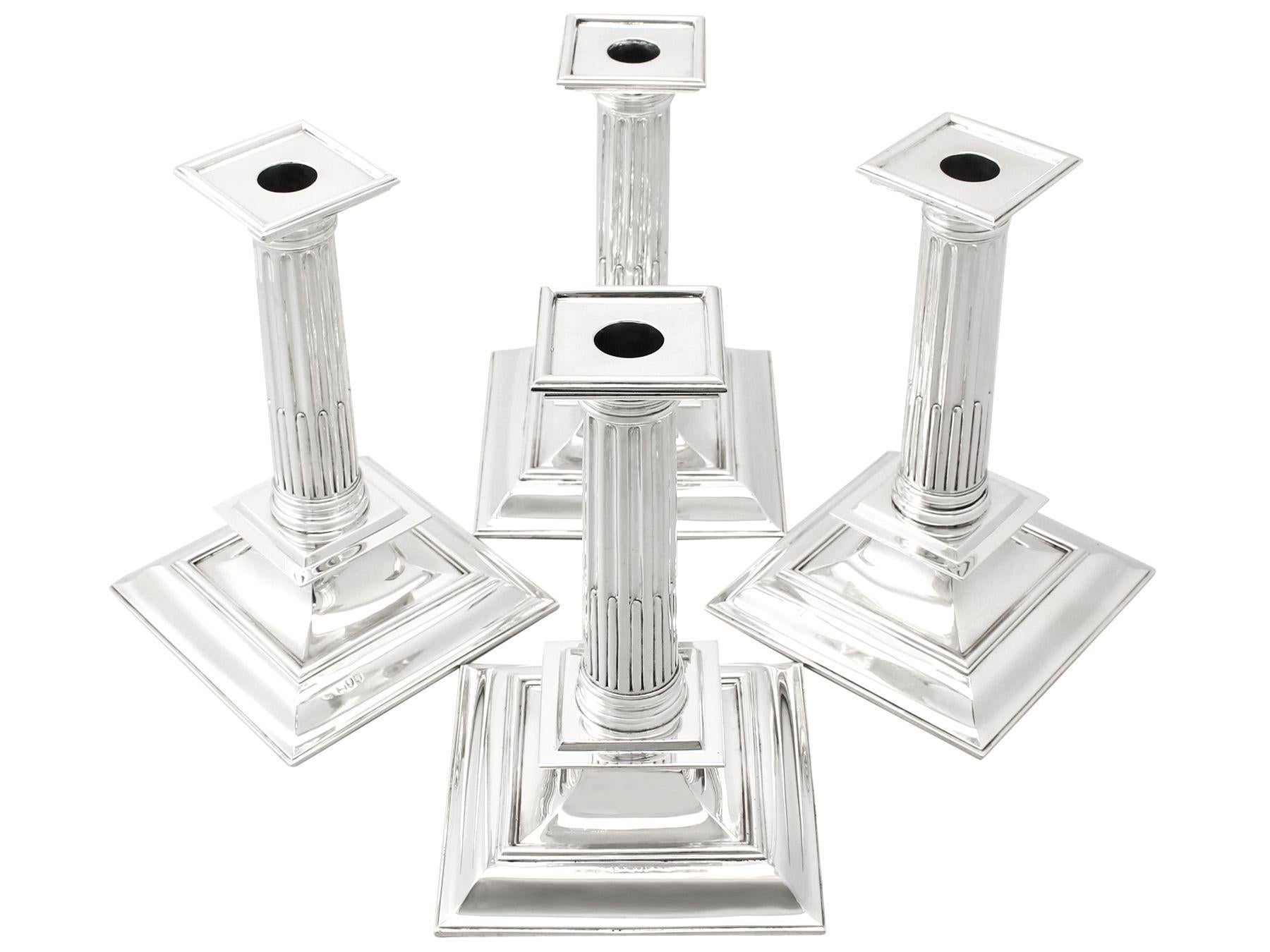 A magnificent, fine and impressive, composite set of four Victorian English sterling silver candlesticks in the Charles II style; an addition to our Victorian silverware collection.

These magnificent antique Victorian candlesticks have been crafted