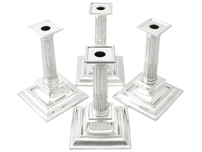A magnificent, fine and impressive, composite set of four Victorian English sterling silver candlesticks in the Charles II style; an addition to our Victorian silverware collection.

These magnificent antique Victorian candlesticks have been