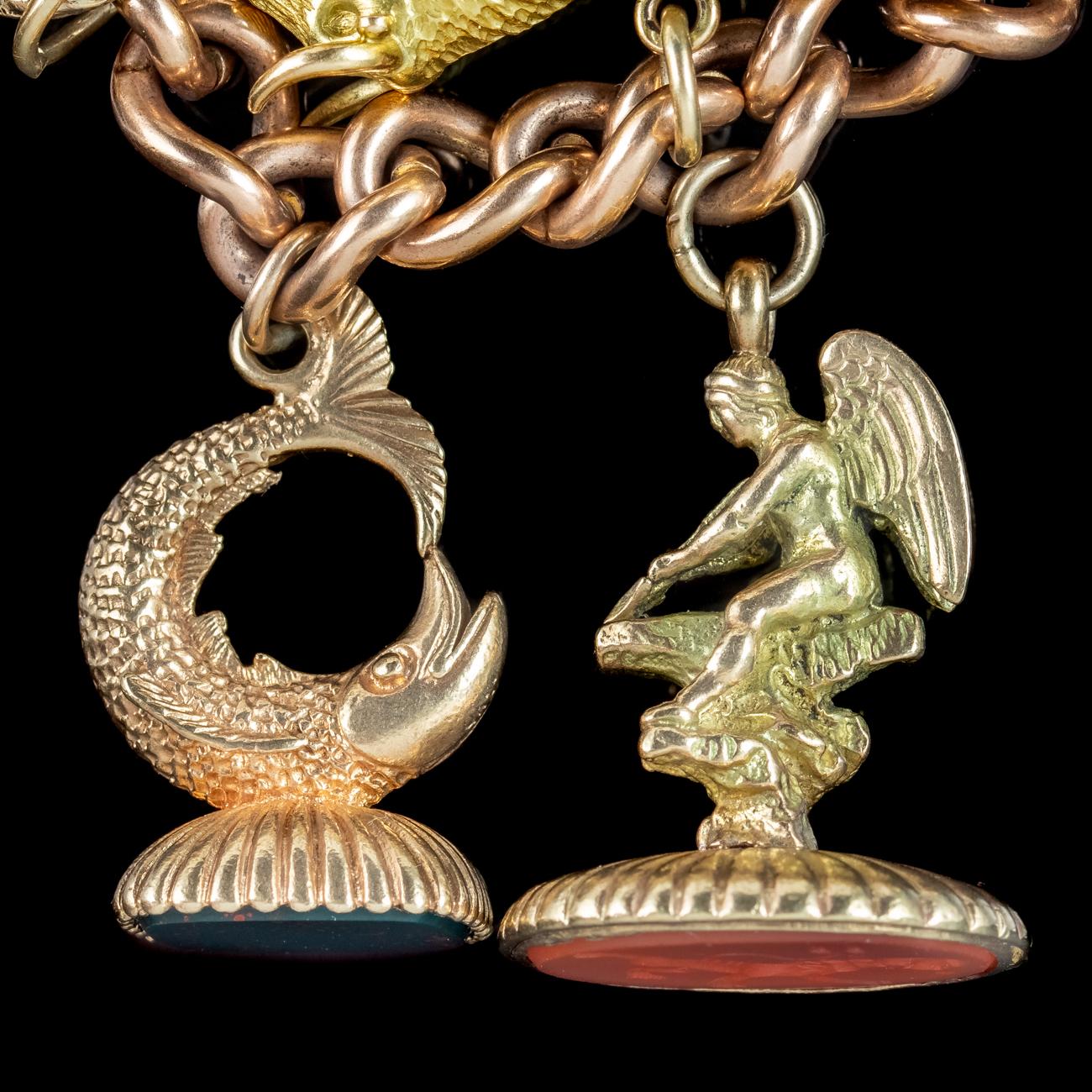 Antique Victorian Charm Bracelet With 12 Charms And Fobs For Sale at