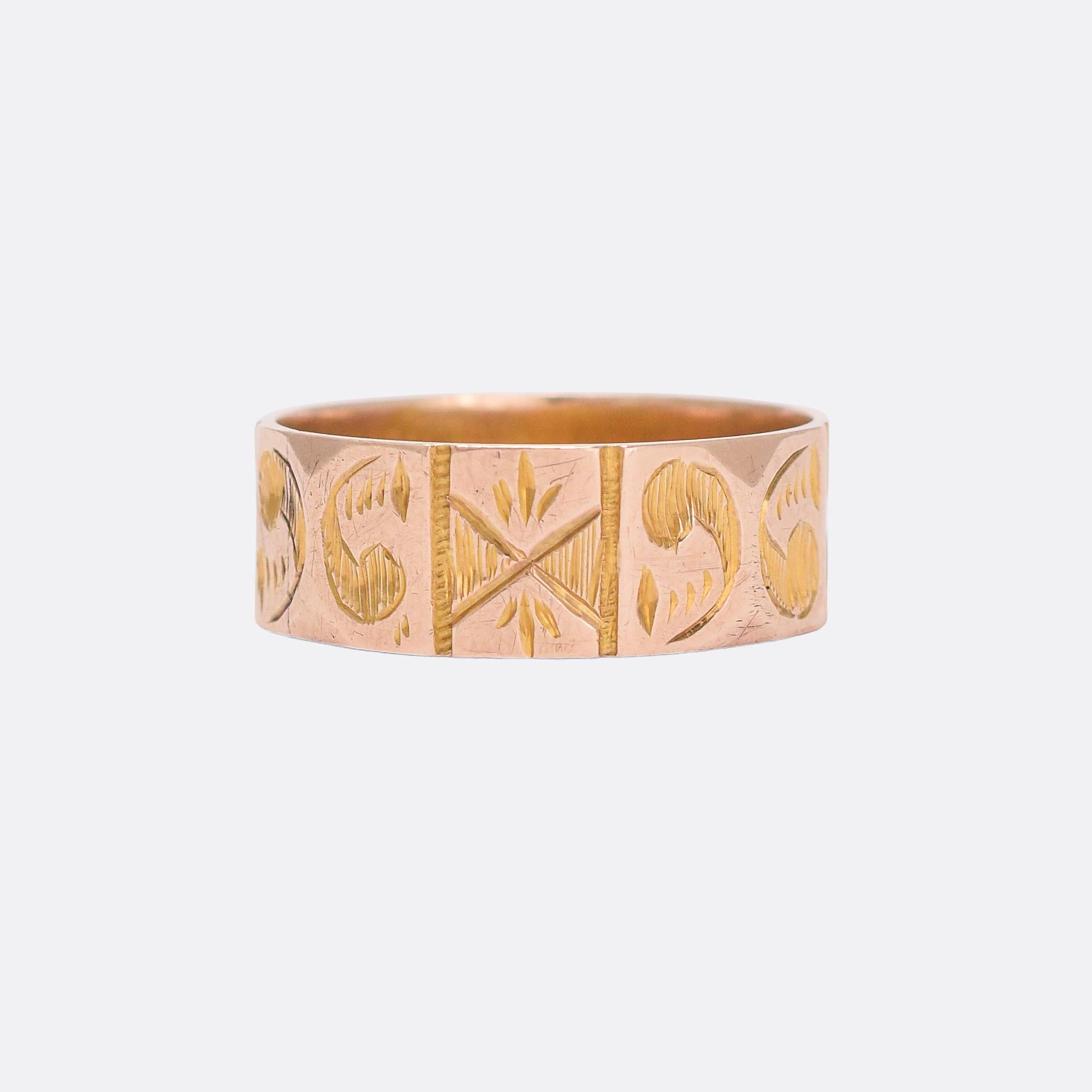 A sweet antique cigar band featuring a faceted outer edge adorned with chased star and apostrophe motifs. It's modelled in 9 karat gold and dates from 1887, with clear English hallmarks confirming the year and gold content. An attractive piece in a