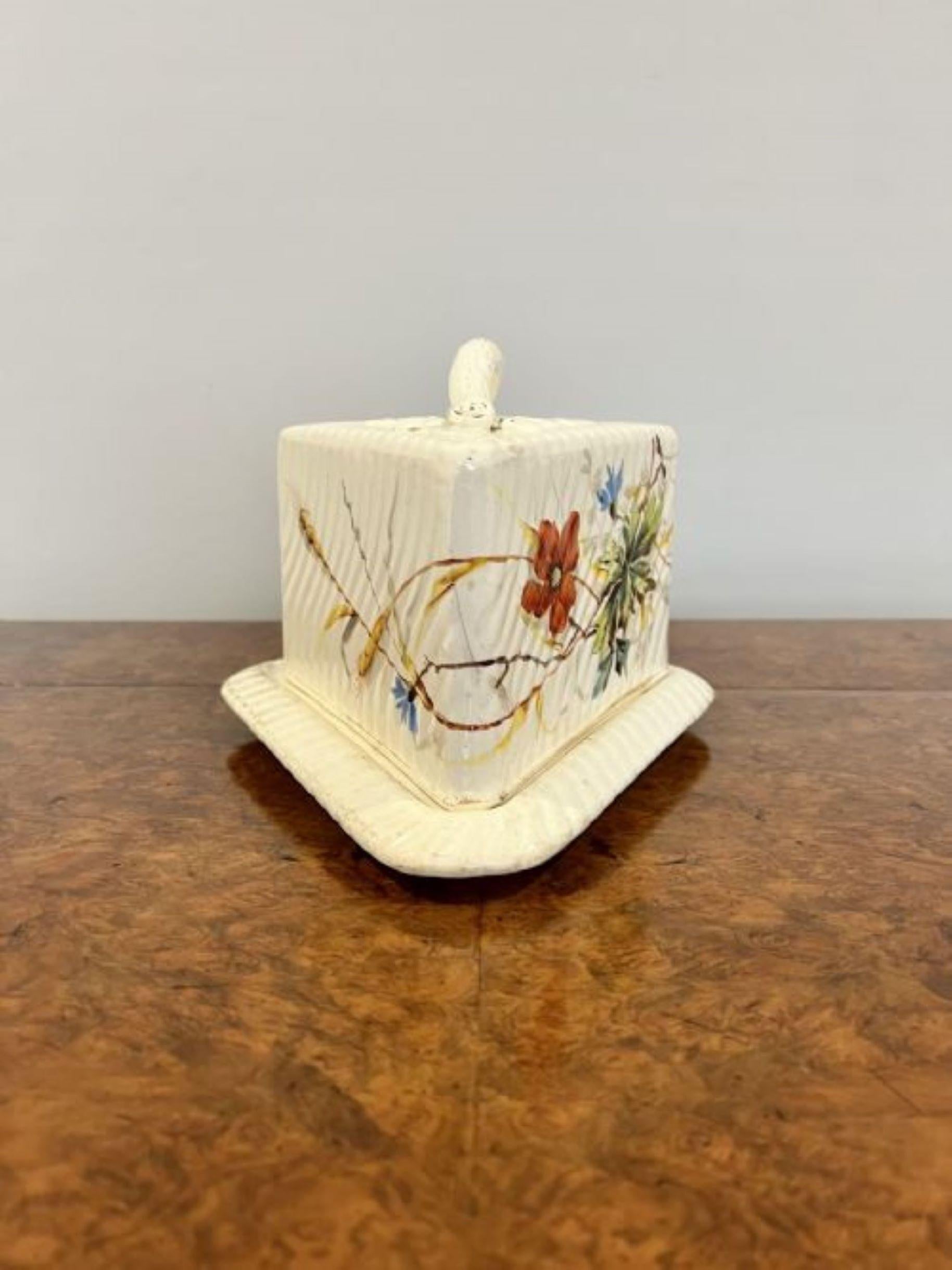 Antique Victorian cheese dish having a shaped handle with leaf decoration to the top with ribbed and floral decoration in wonderful red, blue, yellow, green and white colours standing on the original base