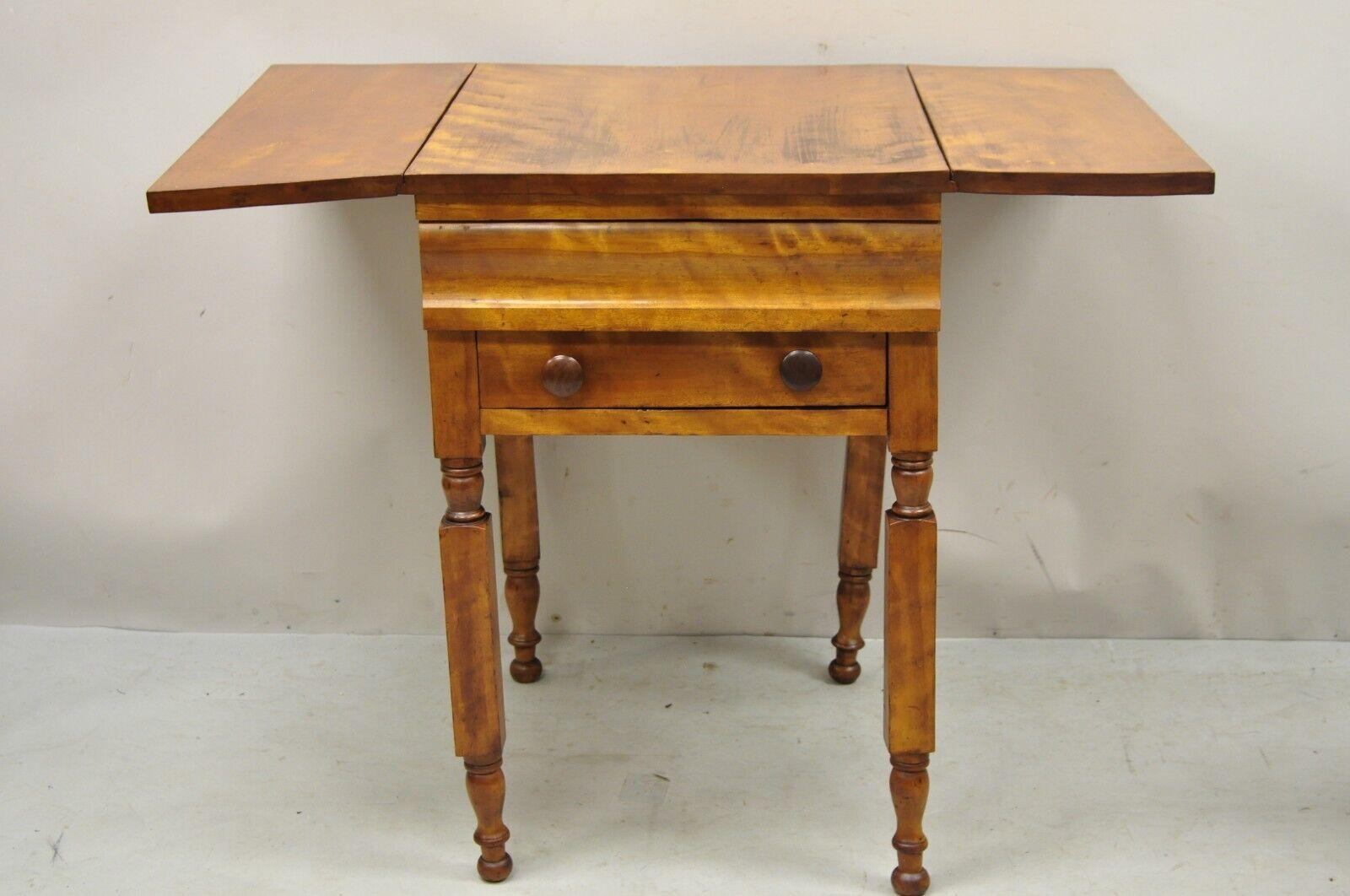 Antique Victorian chestnut drop leaf work table side table with 2 drawers. Item features drop leaf sides, twin carved legs, 2 dovetailed drawers, very nice antique item. Circa 19th Century. Measurements: 28