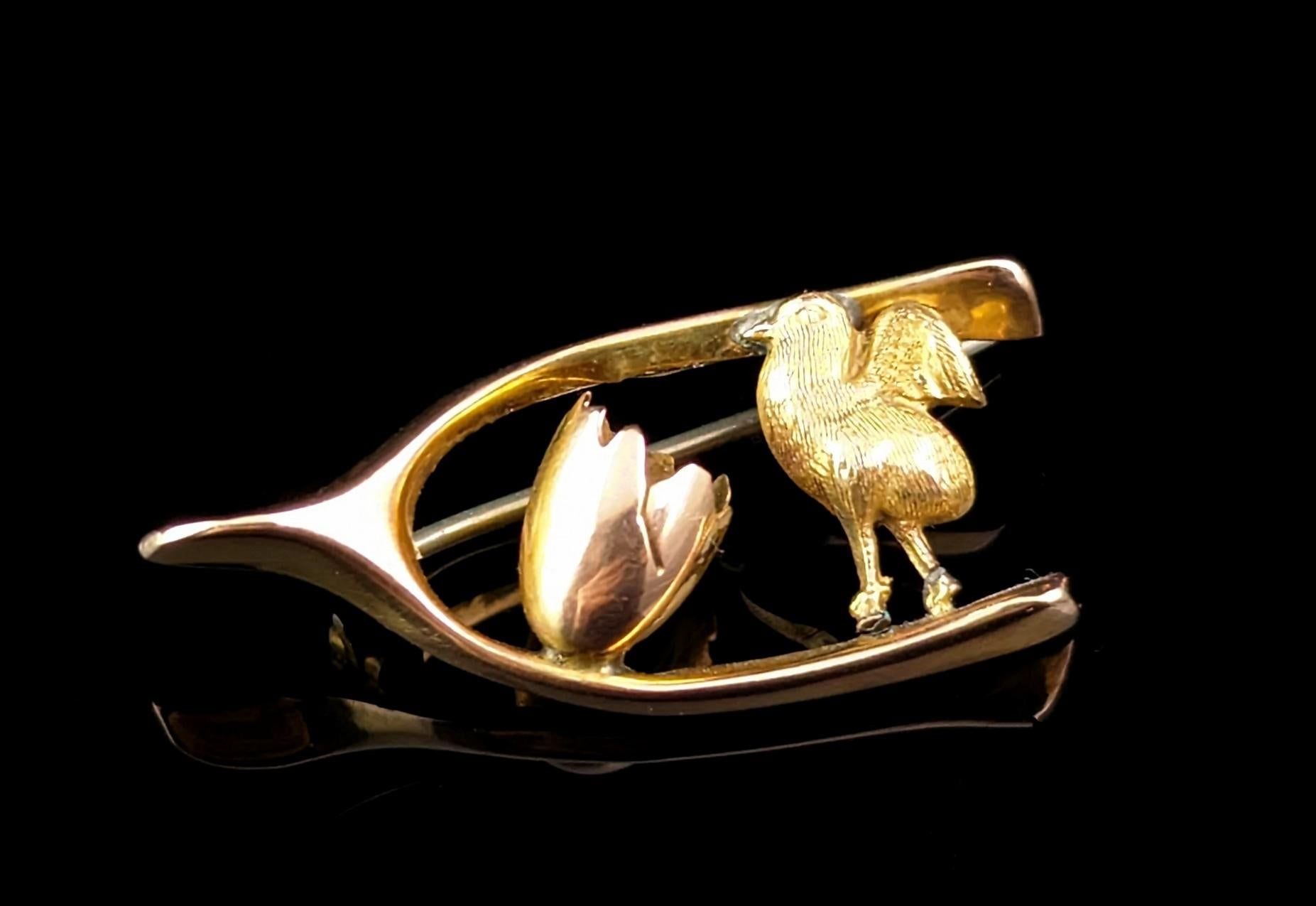 Isn't this dainty antique 9ct gold chick brooch just the sweetest thing?

It features a textured gold chick with half an egg, the chick having emerged from its egg, contained within a lucky wishbone.

Stacked full of Victorian symbolism this small