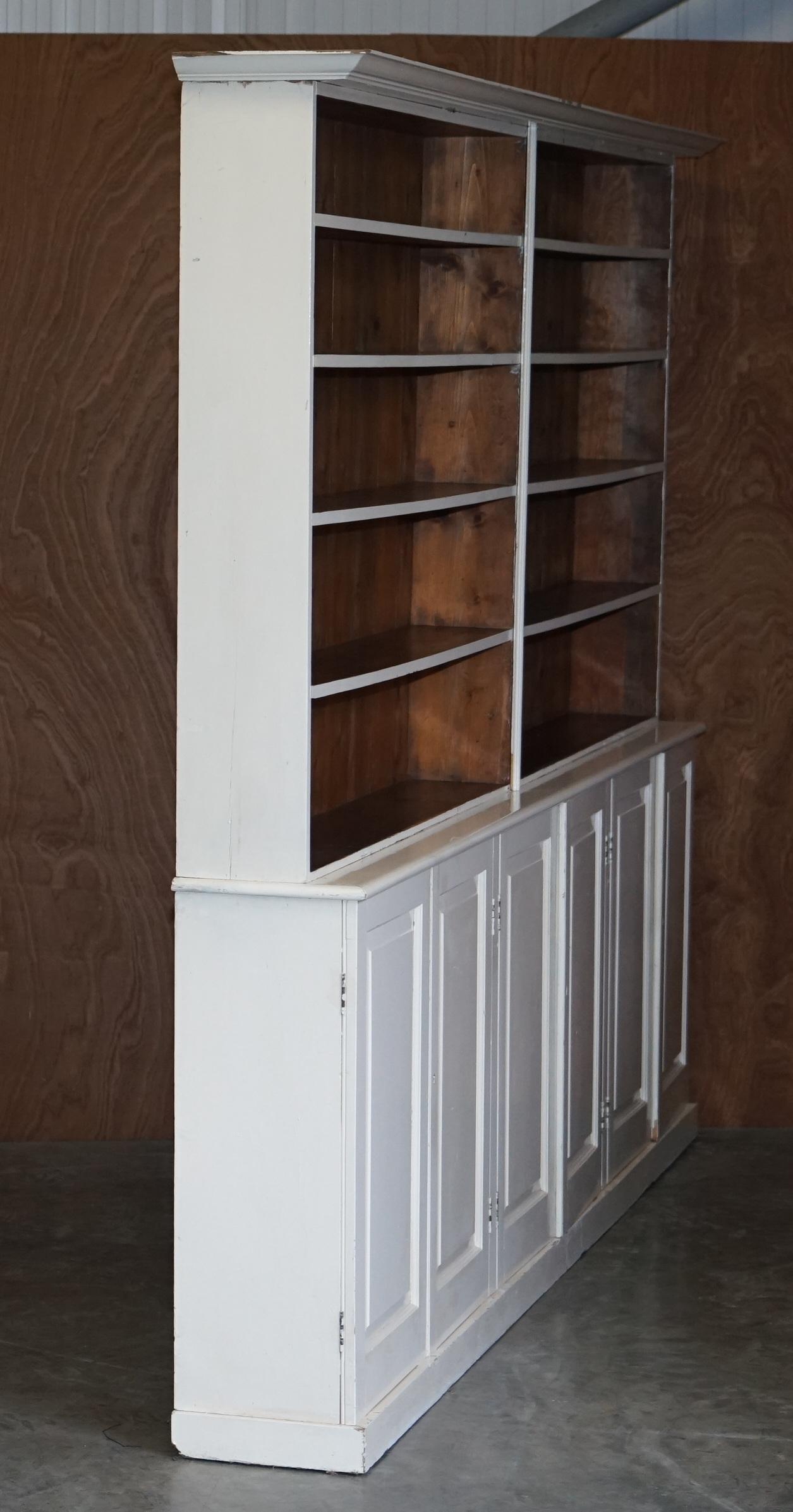 We are delighted to offer for sale this stunning original Victorian Pitch Pine library bookcase with vintage circa 1950's mid century painted finish 

A very good looking well made and decorative piece of English country furniture. It can be used