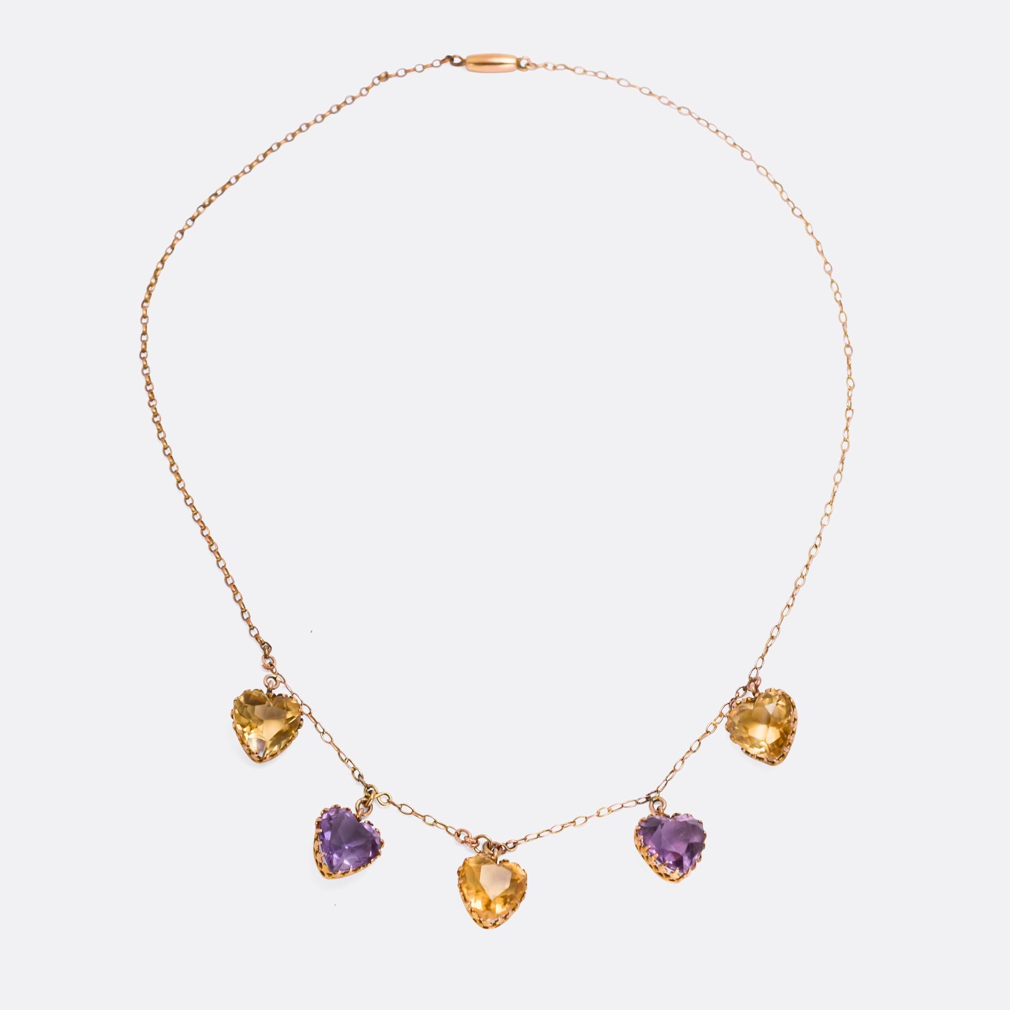 A lovely Victorian fringe necklace set with four heart shaped gemstones in fancy claw mounts: two amethyst and three citrine. It dates from the late 19th Century, modelled in 9 karat gold, and the colour palate is just sublime.

STONES 
Natural