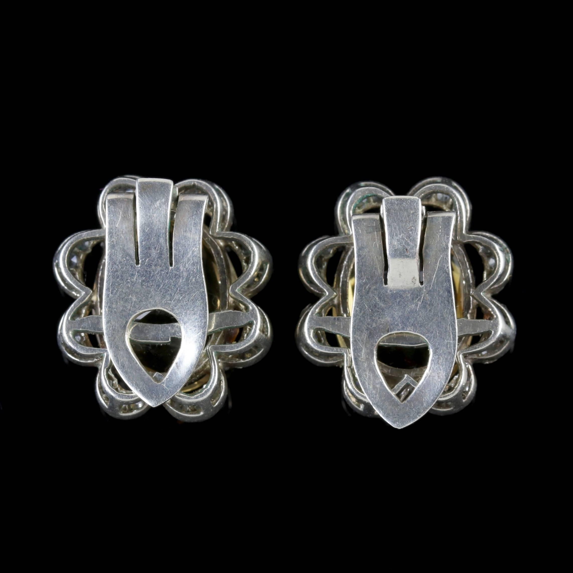 To read more please click continue reading below-
 
These fabulous antique Silver clip earrings are Victorian Circa 1900. 

Each earring is adorned with a bright 8.5ct Citrine surrounded by a halo of sparkling white Paste Stones. 

Citrine’s sparkle