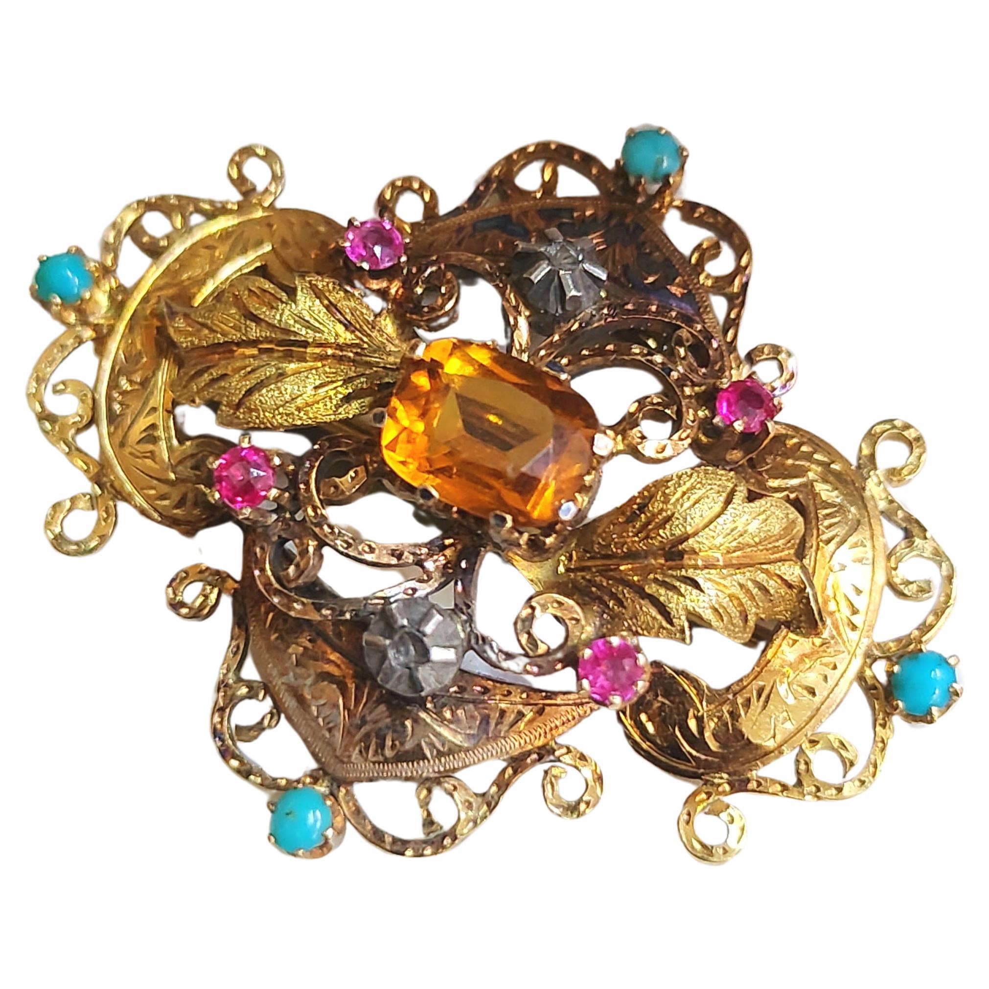 Antique victorian era 18k gold brooch with natural colorful gem stones centered with cetrine stone flanked with rubies and terqouise and rose cut diamond in detailed workmanship dates back to 1880s