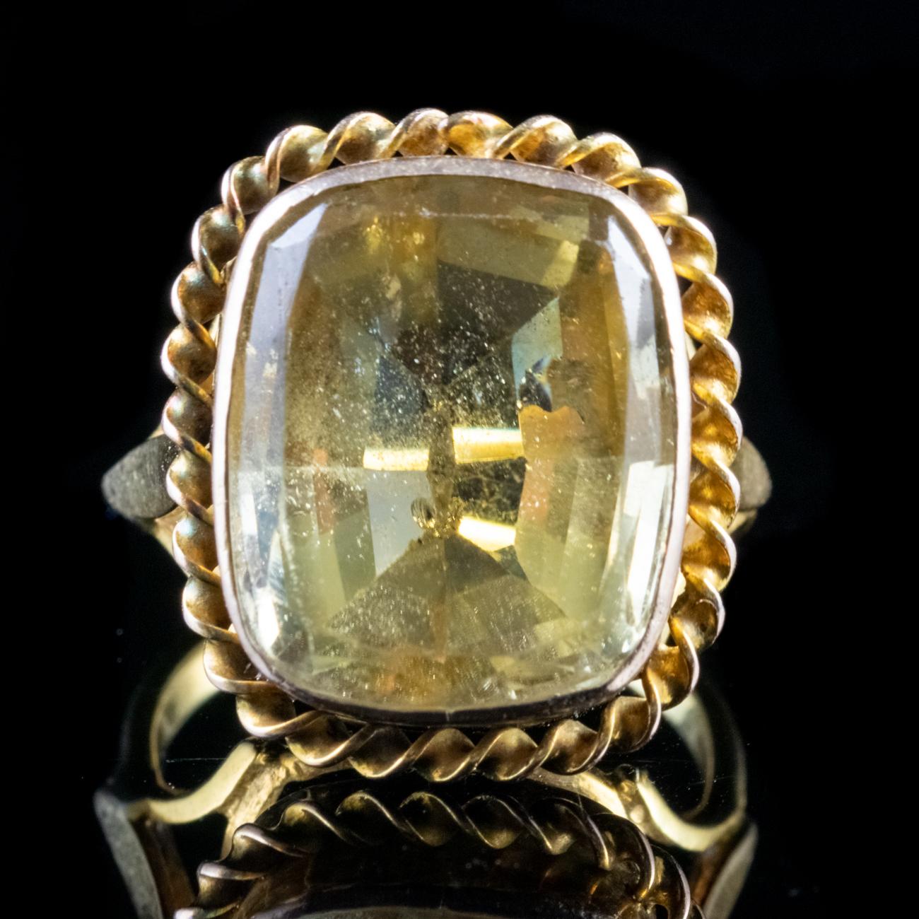 This fabulous Antique Victorian ring is modelled in 18ct Yellow Gold and boasts a magnificent 12ct Natural Citrine. The Citrine is set in an ornate gallery with a lovely rope edge, which sits proudly off the finger.

Citrines sparkle with a crisp