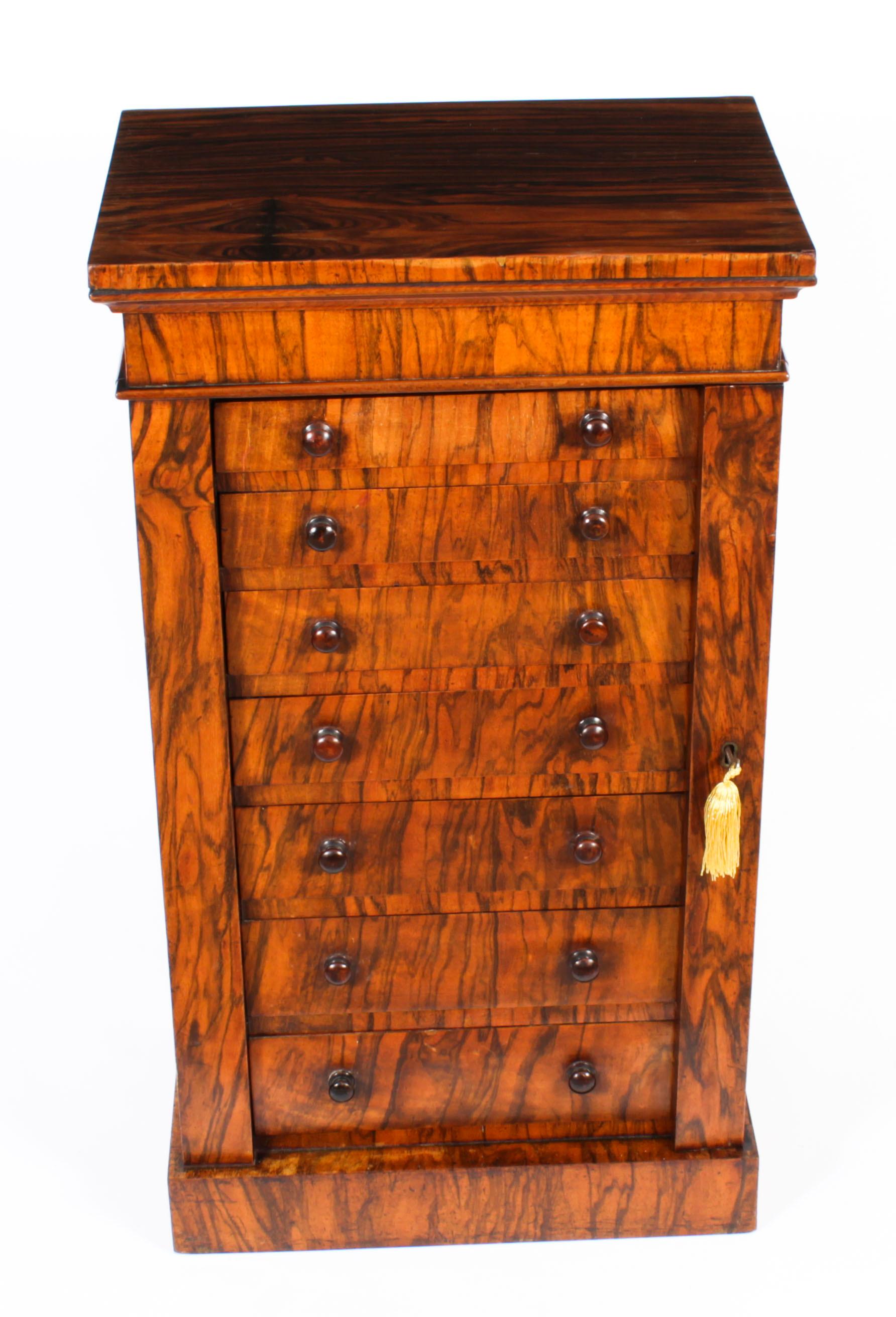 This is a fabulous antique English Victorian burr walnut table-top collector's specimen cabinet or Wellington chest, circa 1850 in date.
 
The piece is made from beautiful burr walnut which has a stunning grain and colour, and features seven