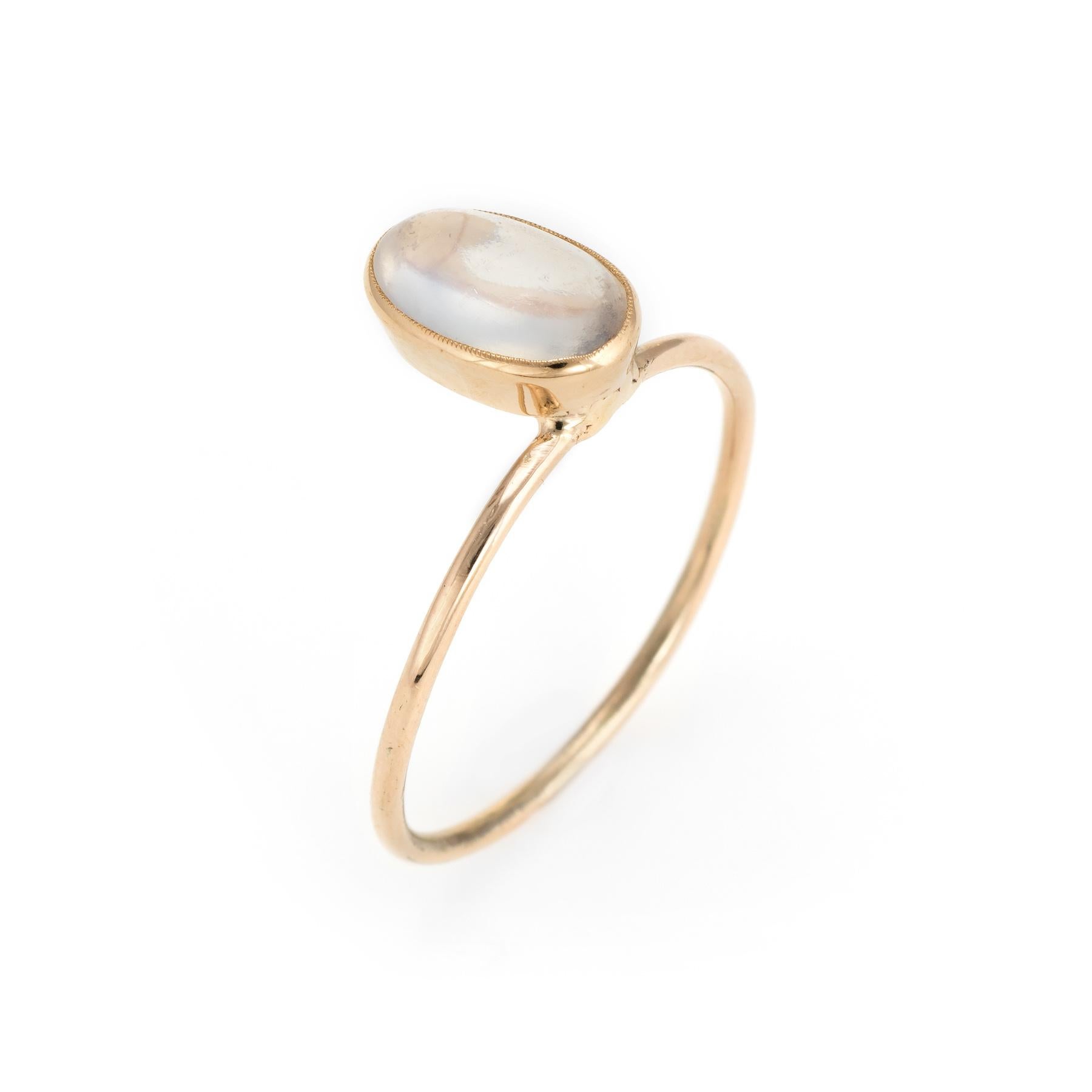 Originally an antique Art Nouveau era stick pin (circa 1900s), the moonstone ring is crafted in 14 karat yellow gold. 

The ring is mounted with the original stick pin. Our jeweler rounded the stick pin into a slim band for the finger. The moonstone