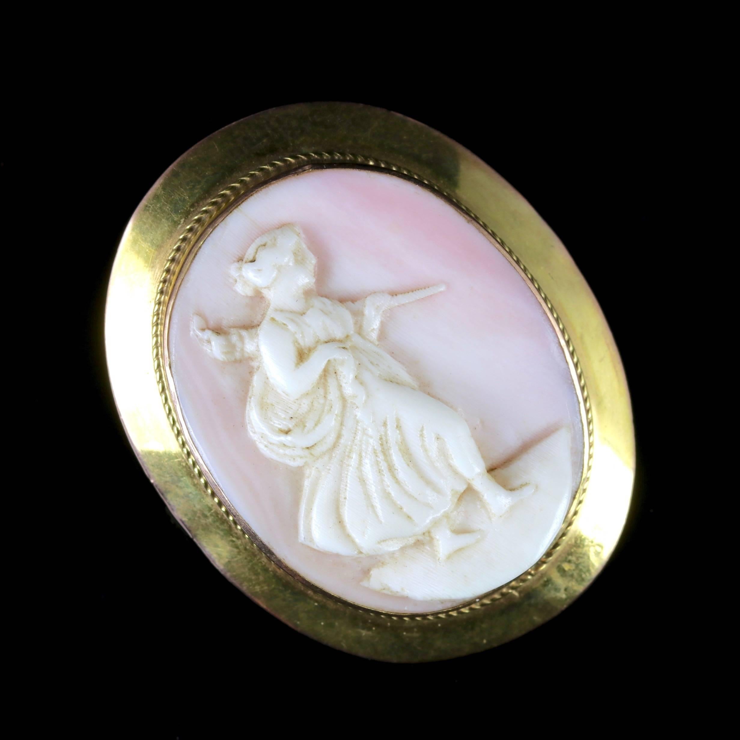 This elegant 9ct Gold Victorian hand-carved Cameo brooch is, Circa 1900.

The Cameo brooch boasts an angle skin coral which is hand-carved with a beautiful lady walking.

From the depths of the sea, comes the beautiful coral which is produced by