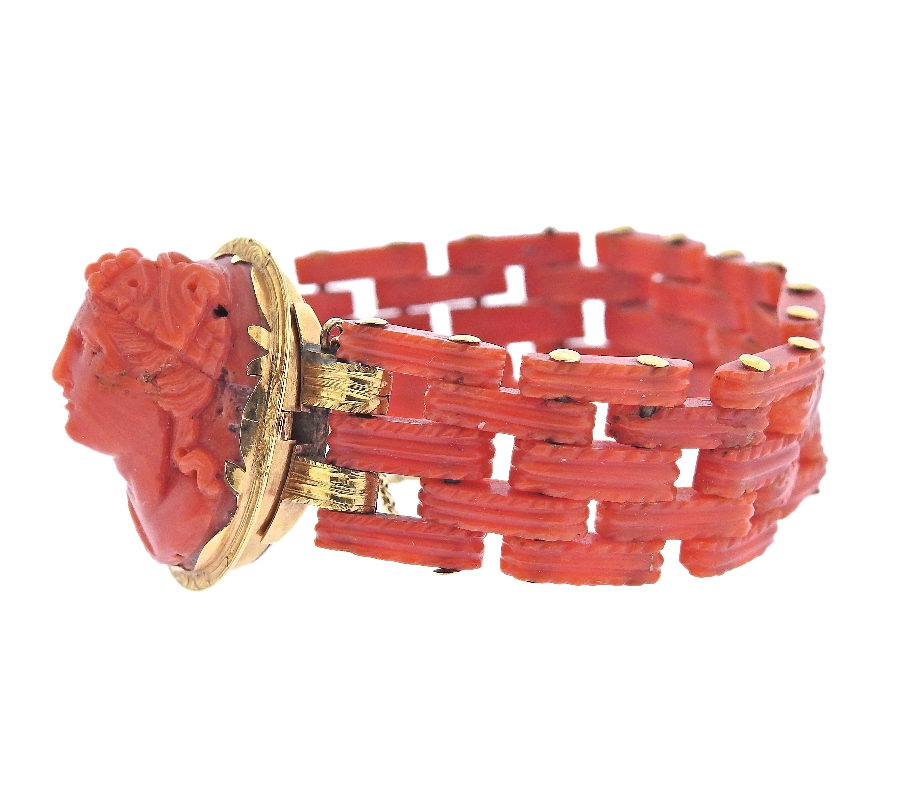 Antique Victorian bracelet, set in 18k gold with coral links and coral cameo in the center. Bracelet is 6.5