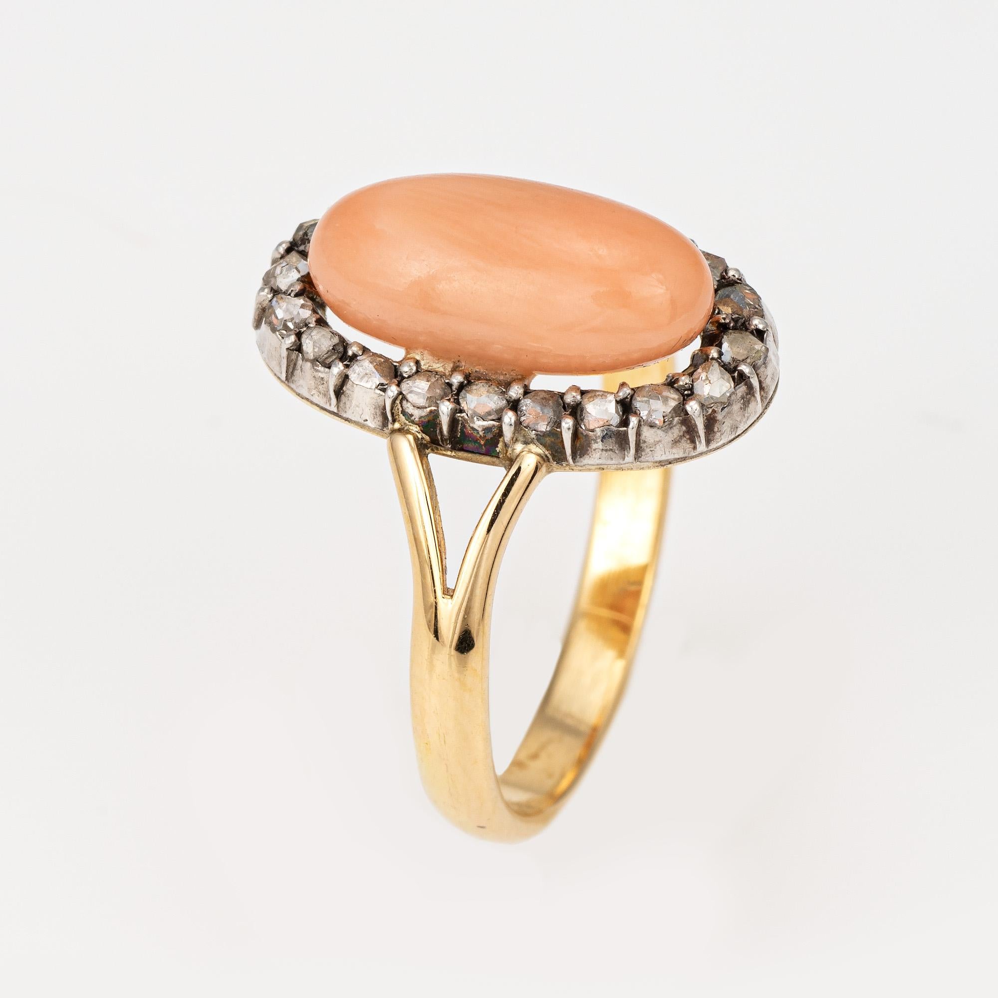 Stylish antique Victorian angel skin coral & diamond ring (circa 1880s to 1900s) crafted in 18 karat yellow gold. 

Cabochon cut angel skin coral measures 12mm x 5.5mm. The coral is in good condition and free of cracks or chips. 20 old rose cut