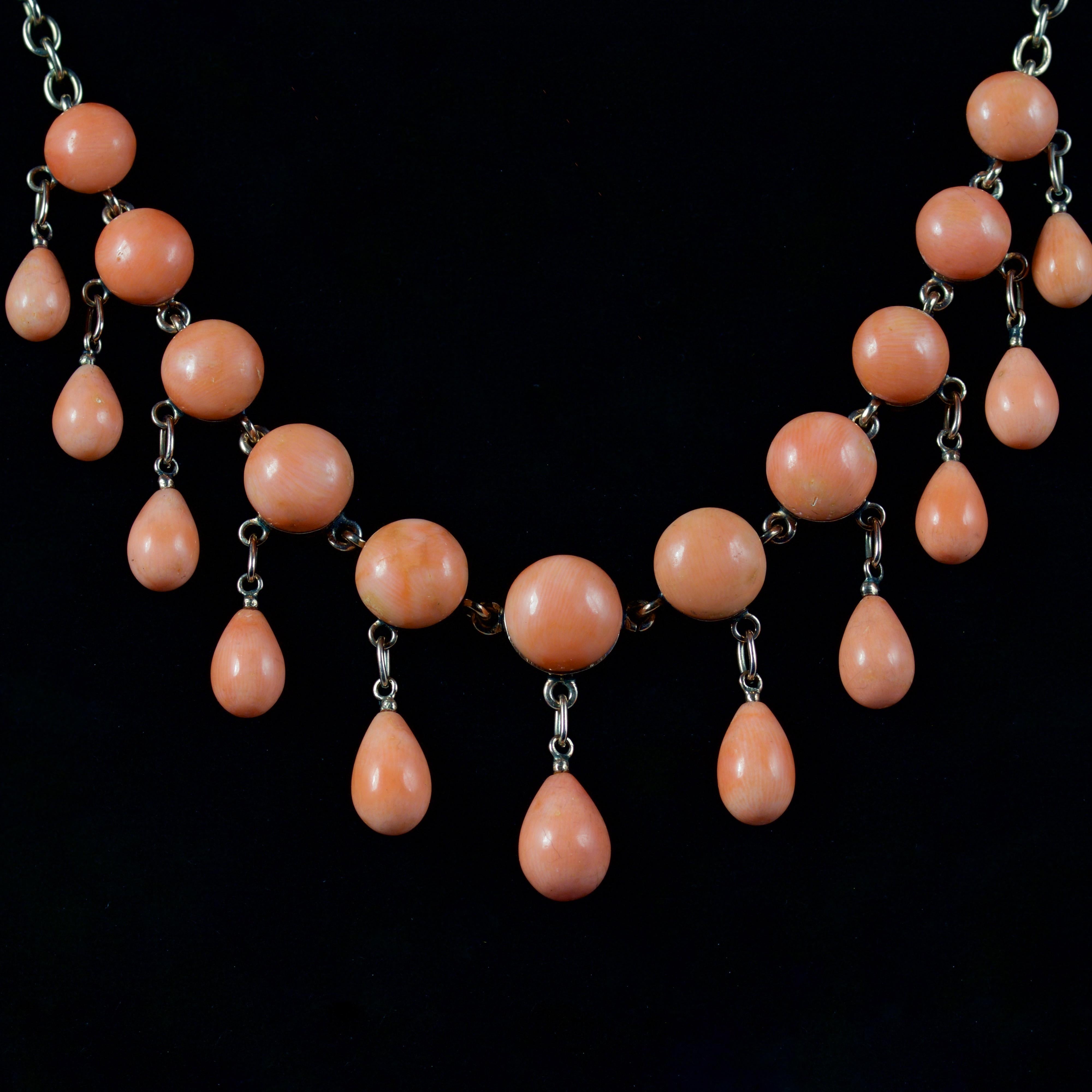 This wonderful Victorian Coral fringe necklace is, Circa 1880

The necklace boasts beautiful Corals set on a rolled Gold chain.

The largest Coral is 3.5ct and the smallest is 2ct, with smaller teardrop shaped Corals hanging beautifully from the