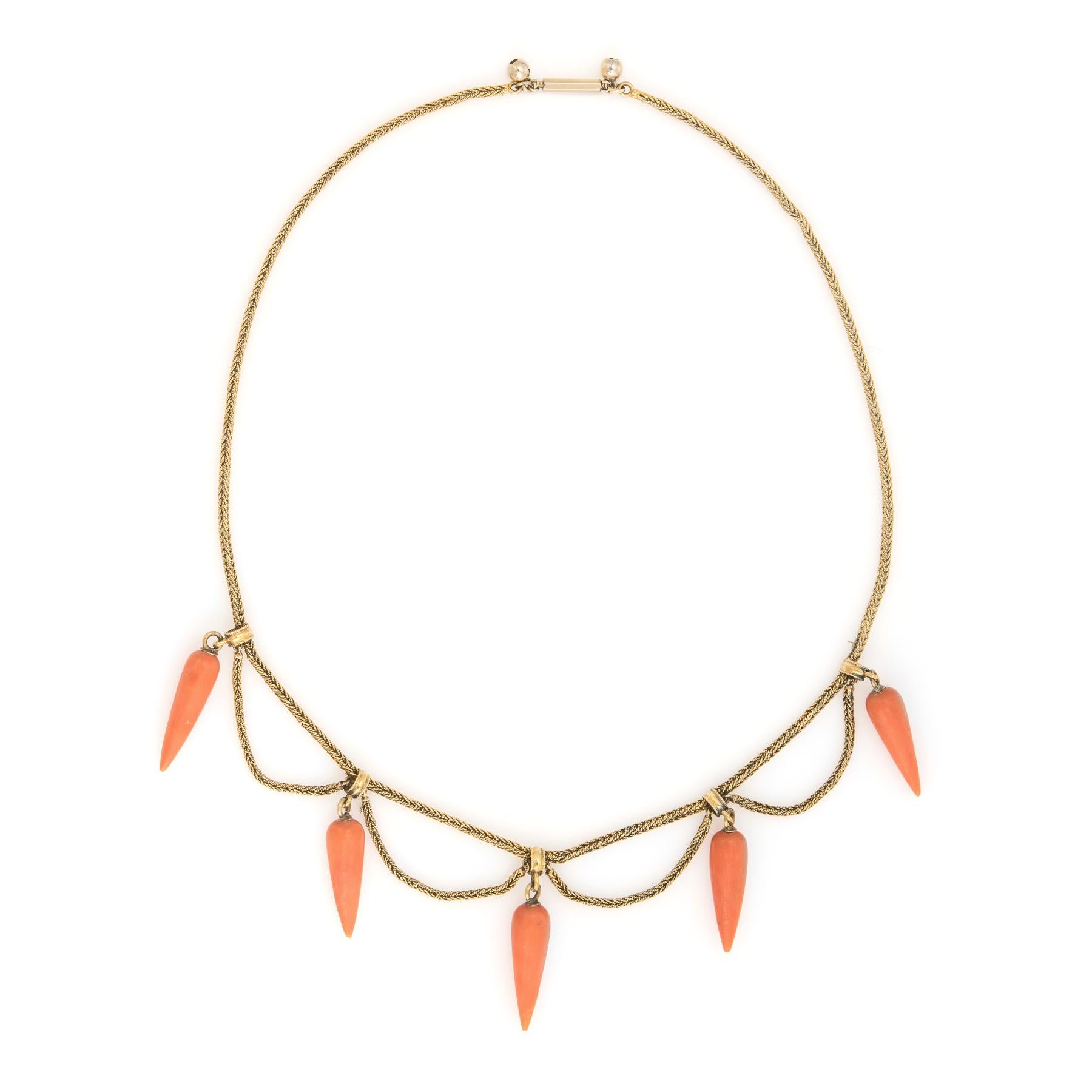 Finely detailed antique Victorian necklace (circa 1880s to 1900s), crafted in 14 karat yellow gold.  

The 5 natural coral drops each measure 21mm x 6.5mm. The coral is a salmon-orange hue. The drops are in excellent condition and free of cracks or