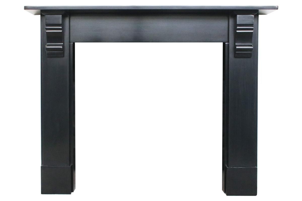 Antique Victorian slate surround with geometric carved corbels supporting the shelf. Circa 1890. Finished with traditional slate blacking.

For detailed sizes see the size diagram in the image gallery.