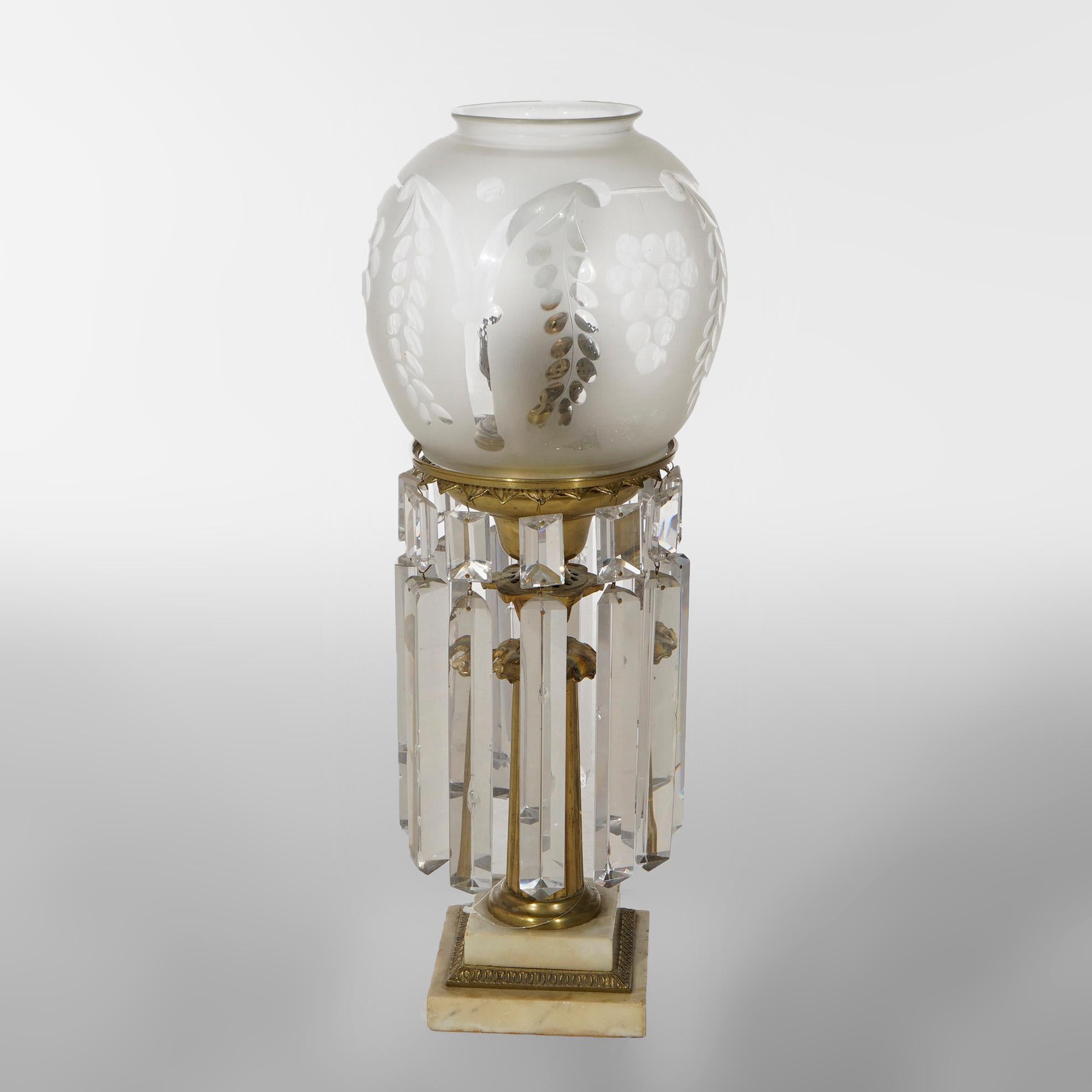 An antique Victorian solar Astral lamp in the manner of Cornelius offers frosted shade with grape motif over brass base having cut crystals, reeded column and marble foot, electrified, c1840

Measures- 21.25'' H x 8.5'' W x 8.5'' D.