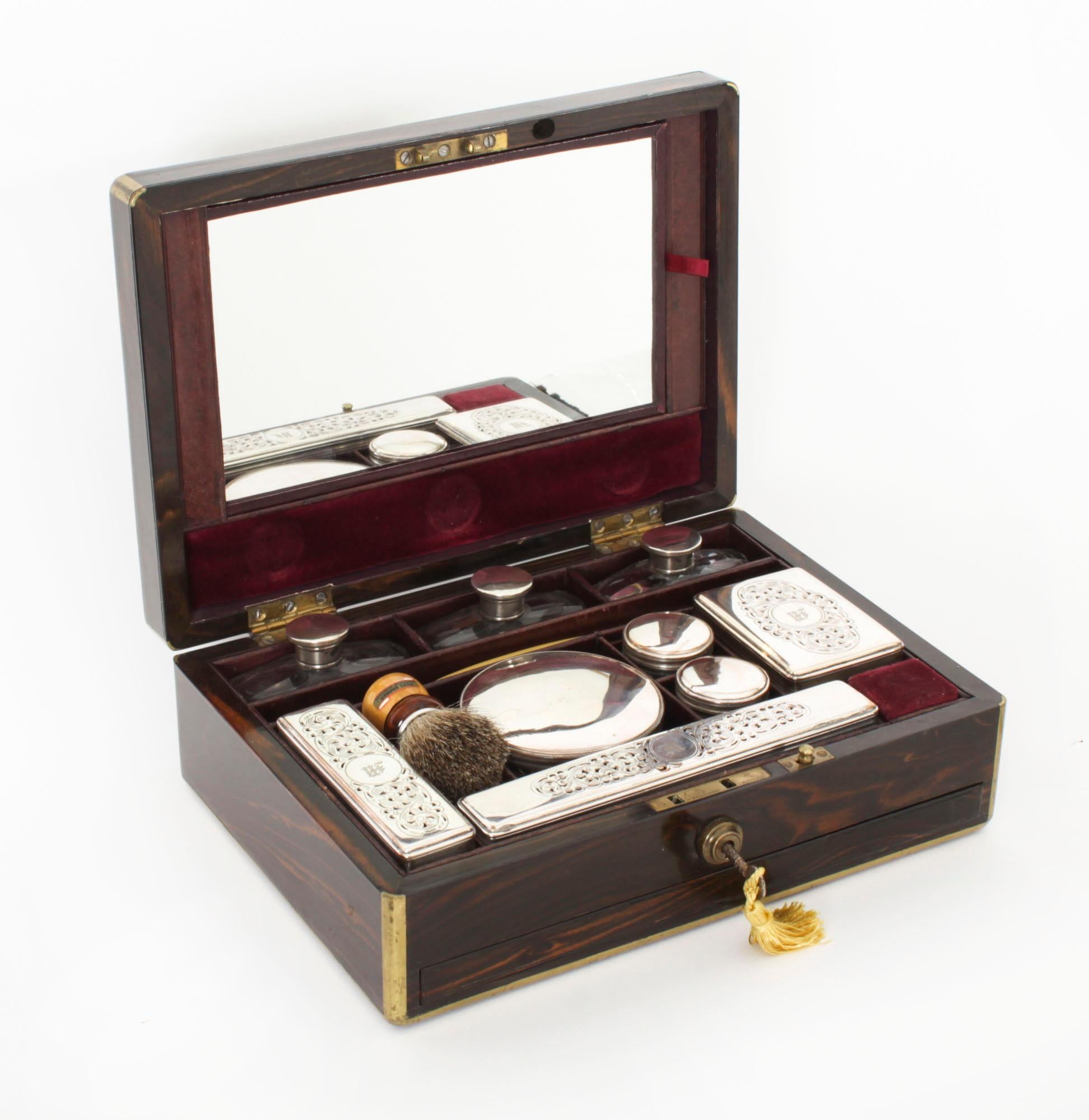 This is a stunning antique Victorian Coromandel gentleman's travelling vanity case with fitted interior, circa 1865 in date.

This rectagular shaped traveling case is made of rare coromandel wood and features a blank brass plaque. The interior is