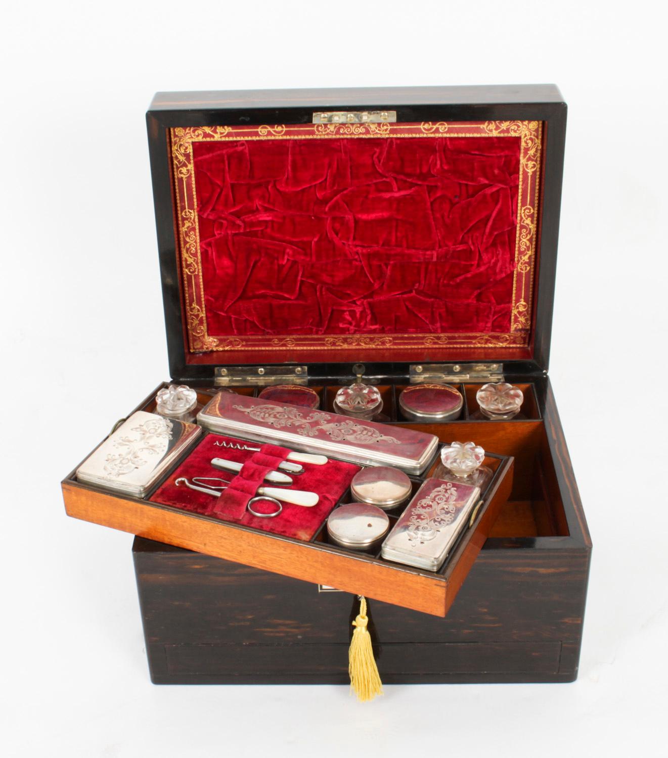 This is a stunning antique Victorian lady's travelling case, circa 1870 in date.
 
This traveling case is made of coromandel wood and features a mother of pearl initialled plaque.
 
The interior is well fitted with twelve Sheffield silver plated