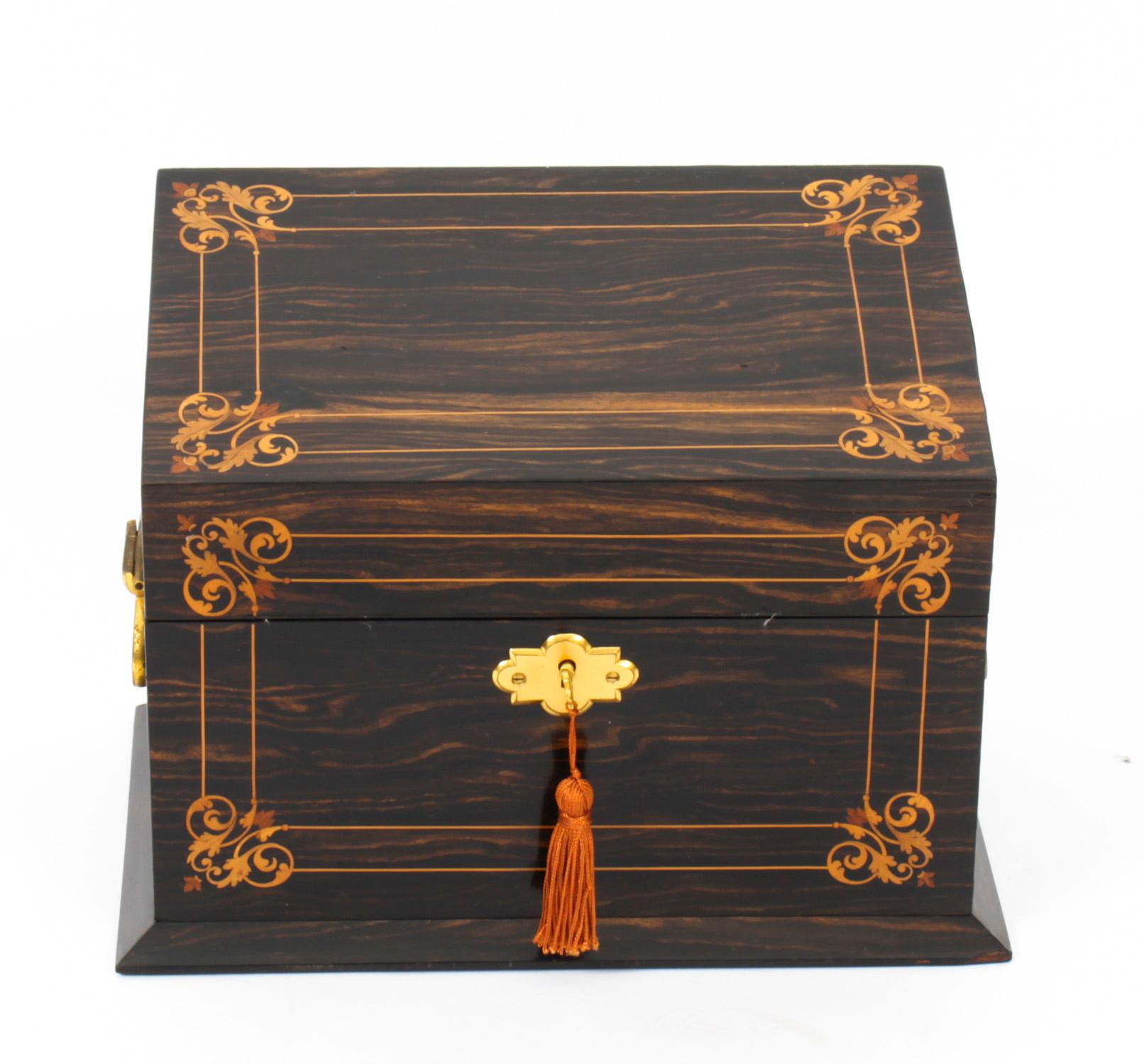 This is a stunning antique Victorian coromandel, Marquetry and gilt bronze mounted stationery box casket, circa 1870 in date.

Elegantly decorated with specimen marquetry with gilt bronze handles to each side, the rectangular casket has a sloped