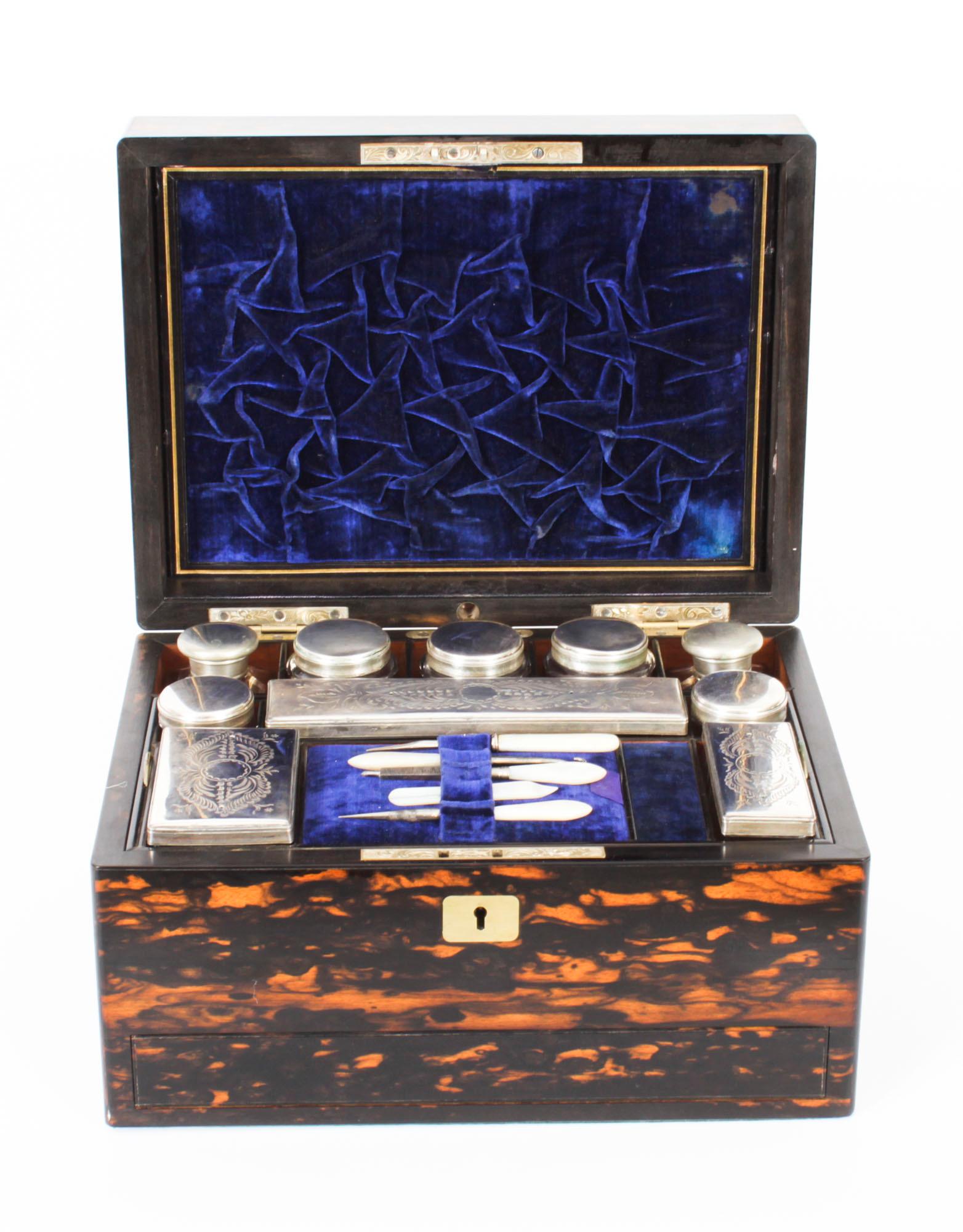 This is a stunning antique Victorian Coromandel travelling case with fitted interior, circa 1830 in date.
 
This traveling case is made of rare coromandel wood and features a brass plaques. The interior is well fitted with te Sheffield silver