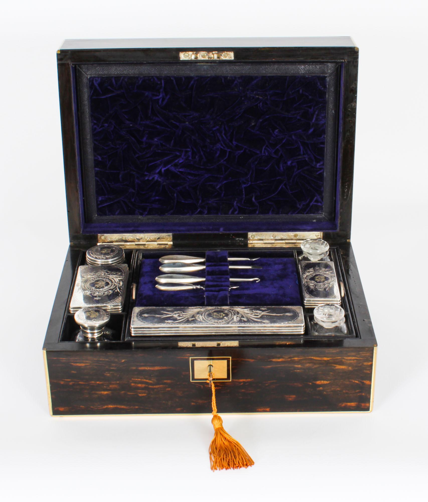 This is a stunning antique Victorian coromandel travelling case, circa 1860 in date.
 
This traveling case is made of rare coromandel wood and features a brass borders and plaques. The interior is well fitted with five Sheffield silver plated