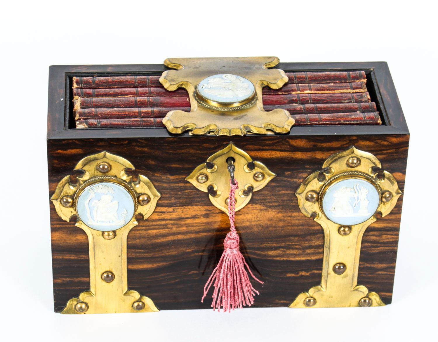 A very fine antique Victorian Coromandel personal book holder attributed to the world famous London box makers Betjemann & Sons, circa 1870 in date.
 
The rectangular box features gothic revival brass strap work mounts set with Wedgwood jasper