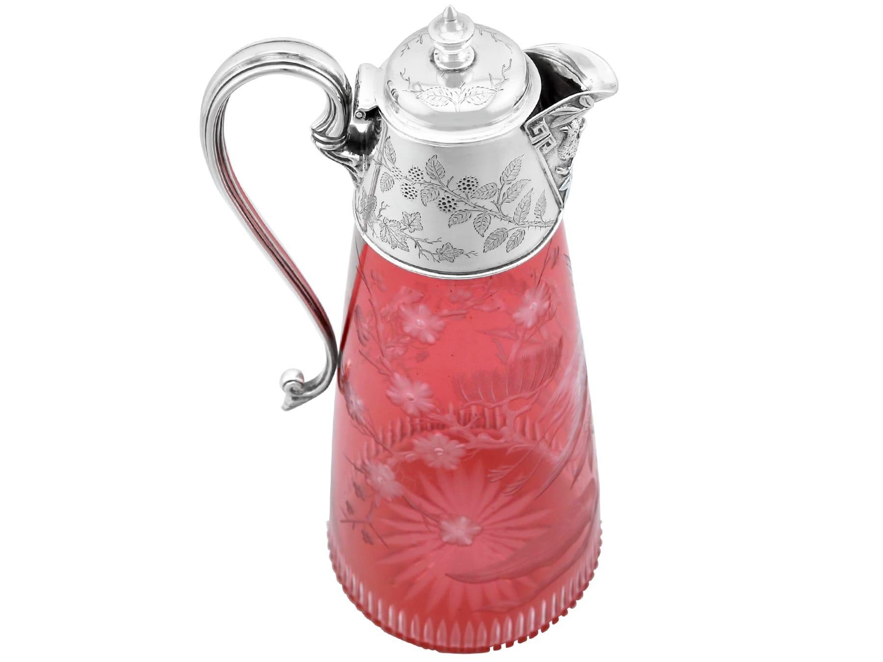 An exceptional, fine and impressive antique Victorian cranberry glass and silver mounted claret jug; part of our silver mounted glass collection

This exceptional antique Victorian sterling silver and glass claret jug has a tapering cylindrical